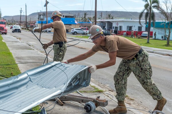 TINIAN, Commonwealth of the Northern Marianas Islands (Nov. 1, 2018) Sailors assigned to the U.S. Navy’s Naval Mobile Construction Battalion 1 removes debris from a road during recovery operations following Typhoon Yutu. Service members from Joint Region Marianas and Indo-Pacific Command are providing Department of Defense support to the Commonwealth of the Northern Mariana Islands' civil and local officials as part of the FEMA-supported Typhoon Yutu recovery efforts.