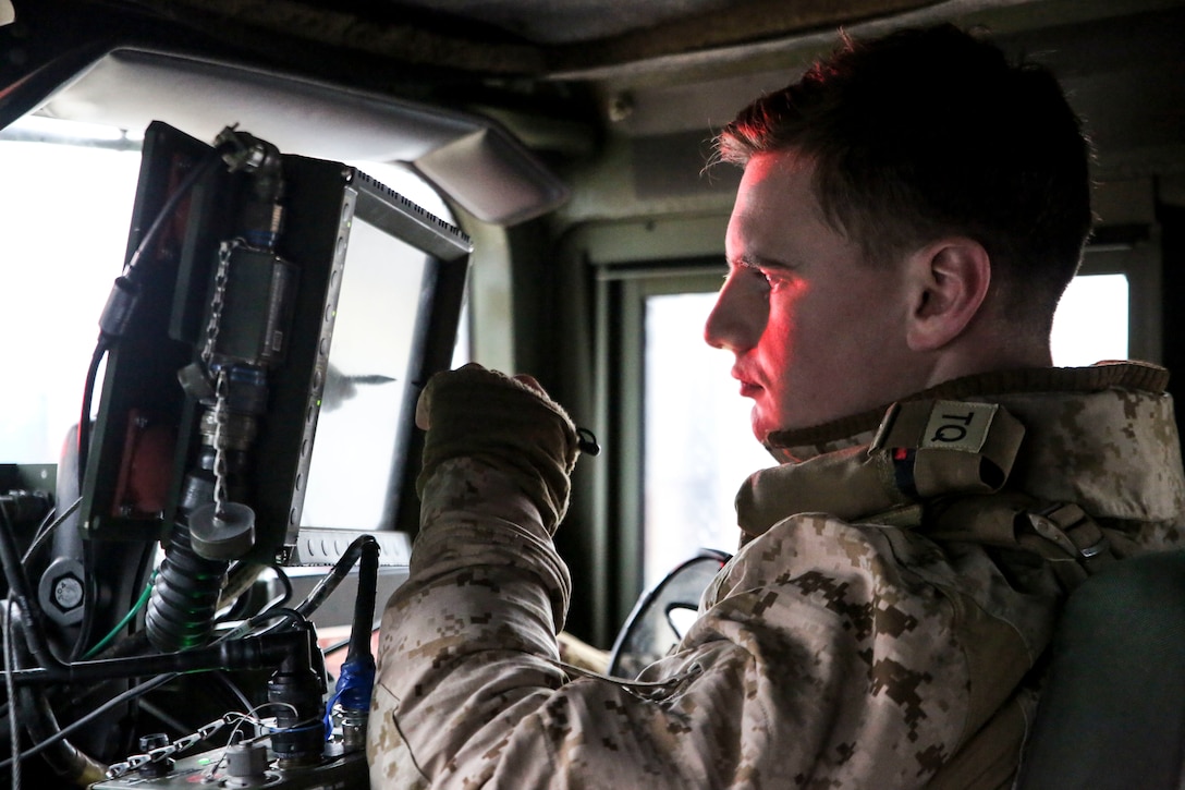 U.S. Marine Corps Lance Cpl. Truman Jackson, a data systems administrator with II Marine Support Battalion, II Marine Information Group, communicates with Command Operations Center during a convoy operation for Exercise Trident Juncture 18 in Norway, Nov. 2, 2018. Trident Juncture 18 demonstrates II Marine Expeditionary Force’s ability to deploy, employ, and redeploy the Marine Air Ground Task Force while improving interoperability with NATO allies and partners. (U.S. Marine Corps photo by Cpl. Patrick Osino)