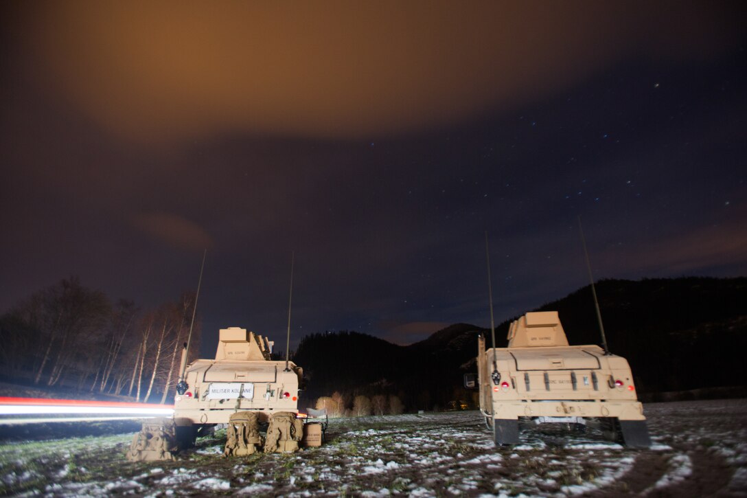 Humvees with Bridge Company, 8th Engineer Support Battalion, 2nd Marine Logistics Group-Forward, use Humvees to provide security before a bridging operation during Exercise Trident Juncture 18 near Voll, Norway, Oct. 29, 2018. The bridge construction enables ground units to complete a gap crossing during the exercise, which is one of the general engineering tasks 2nd MLG provides to the Marine Air-Ground Task Force. Trident Juncture 18 enhances the U.S. and NATO Allies’ and partners’ abilities to work together collectively to conduct military operations under challenging conditions. (U.S. Marine Corps photo by Lance Cpl. Scott R. Jenkins)