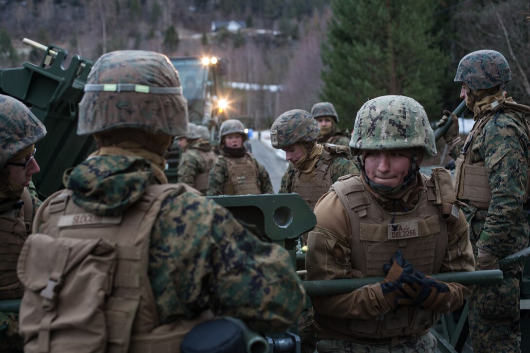 U.S. Marines with Bridge Company, 8th Engineer Support Battalion, 2nd Marine Logistics Group-Forward, assemble a medium girder bridge section during a bridging operation as part of Exercise Trident Juncture 18 near Voll, Norway, Oct. 30, 2018. The bridge construction enables ground units to complete a gap crossing during the exercise, which is one of the general engineering tasks 2nd MLG provides to the Marine Air-Ground Task Force. Trident Juncture 18 enhances the U.S. and NATO Allies’ and partners’ abilities to work together collectively to conduct military operations under challenging conditions. (U.S. Marine Corps photo by Lance Cpl. Scott R. Jenkins)