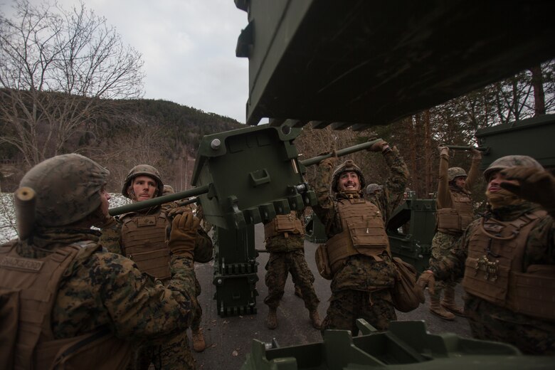 U.S. Marines with Bridge Company, 8th Engineer Support Battalion, 2nd Marine Logistics Group-Forward (2nd MLG-Forward), assemble a medium girder bridge section during a bridging operation as part of Exercise Trident Juncture 18 near Voll, Norway, Oct. 30, 2018. The bridge construction enables ground units to complete a gap crossing during the exercise, which is one of the general engineering tasks 2nd MLG provides to the Marine Air-Ground Task Force. Trident Juncture 18 enhances the U.S. and NATO Allies’ and partners’ abilities to work together collectively to conduct military operations under challenging conditions. (U.S. Marine Corps photo by Lance Cpl. Scott R. Jenkins)