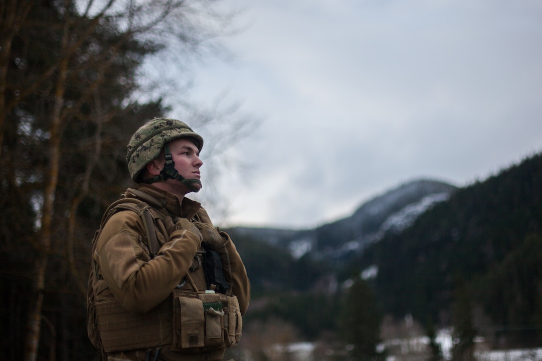 U.S. Navy Seabee Builder 2nd Class Mason Crane with Naval Mobile Construction Battalion 1, 22 Naval Construction Regiment, rests during a bridging operation as part of Trident Juncture 18 near Voll, Norway, on Oct. 29, 2018. The bridge construction enables ground units to complete a gap crossing during the exercise, which is one of the general engineering tasks 2nd Marine Logistics Group provides to the Marine Air-Ground Task Force. Trident Juncture 18 enhances the U.S. and NATO Allies’ and partners’ abilities to work together collectively to conduct military operations under challenging conditions. (U.S. Marine Corps photo by Lance Cpl. Scott R. Jenkins)