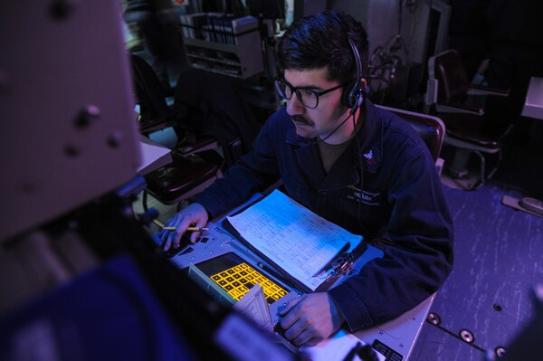 PHILIPPINE SEA (November 2, 2018) Operations Specialist 1st Class Jose Cartagena, from Flowery Branch, Georgia, monitors his workstation in the Combat Direction Center aboard the Navy's forward-deployed aircraft carrier, USS Ronald Reagan (CVN 76) during Keen Sword 2019. Keen Sword 2019 is a joint, bilateral field-training exercise involving U.S. military and Japan Maritime Self-Defense Force personnel, designed to increase combat readiness and interoperability of the Japan-U.S. alliance.