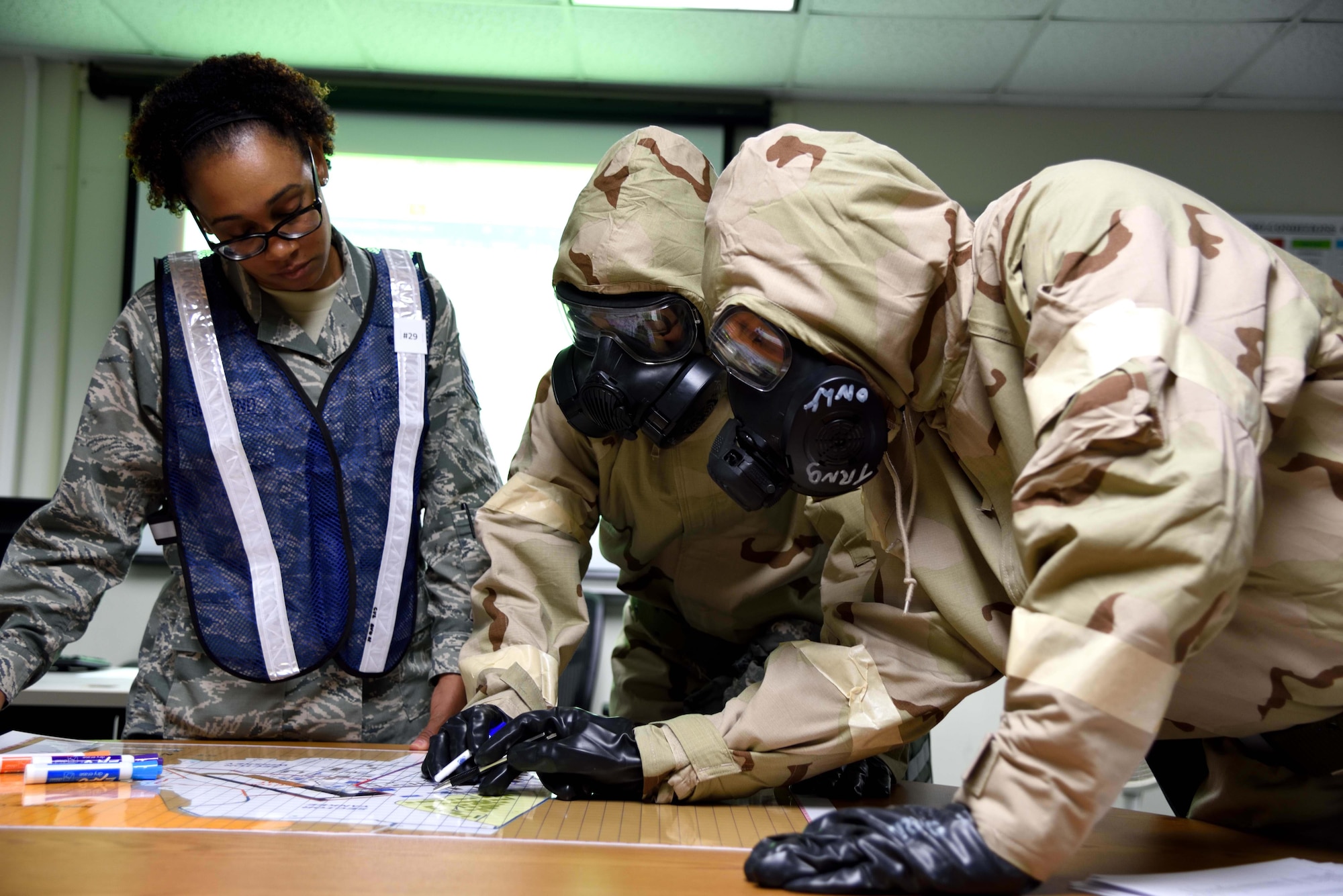 403rd Wing members donned mission oriented protective posture gear, or MOPP gear, during an exercise Nov. 4, 2018, at Keesler Air Force Base, Mississippi. The 403rd Wing participated in an exercise during the November 2018 Unit Training Assembly to test their ability to survive and operate in a deployed environment. (U.S. Air Force photo by Lt. Col. Marnee A.C. Losurdo)
