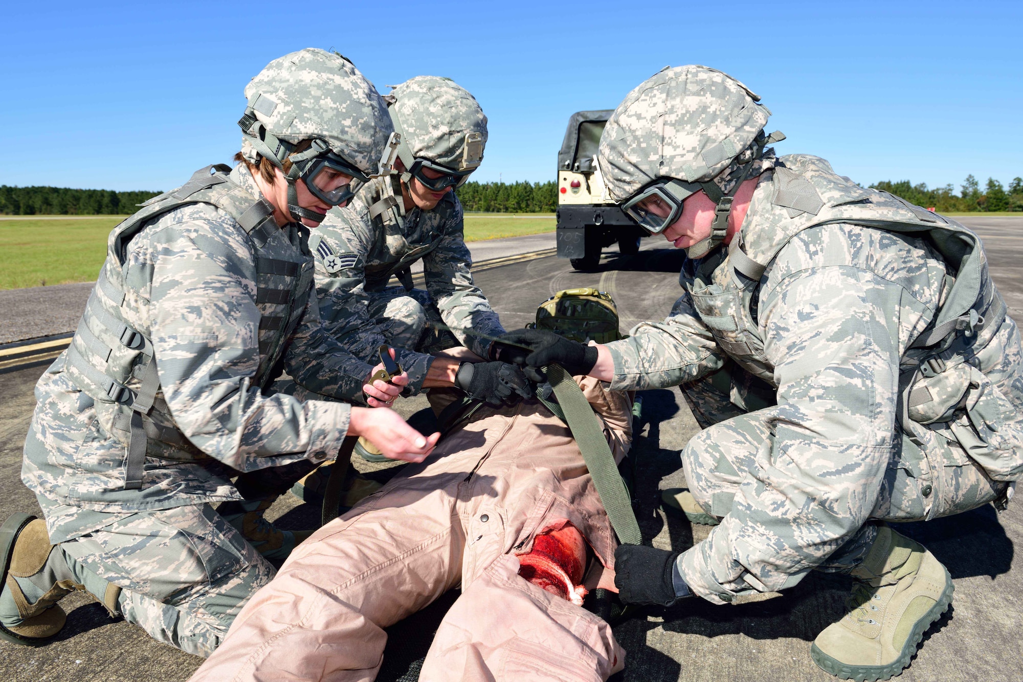 Members of the 36th Aeromedical Evacuation Squadron, which is a part of the 403rd Wing at Keesler Air Force Base, Mississippi, prepare an “injured” patient for airlift during an exercise Nov. 4, 2018, at Camp Shelby, Mississippi. The 403rd Wing participated in an exercise during the November 2018 Unit Training Assembly to test their ability to survive and operate in a deployed environment. (U.S. Air Force photo by Tech. Sgt. Ryan Labadens)