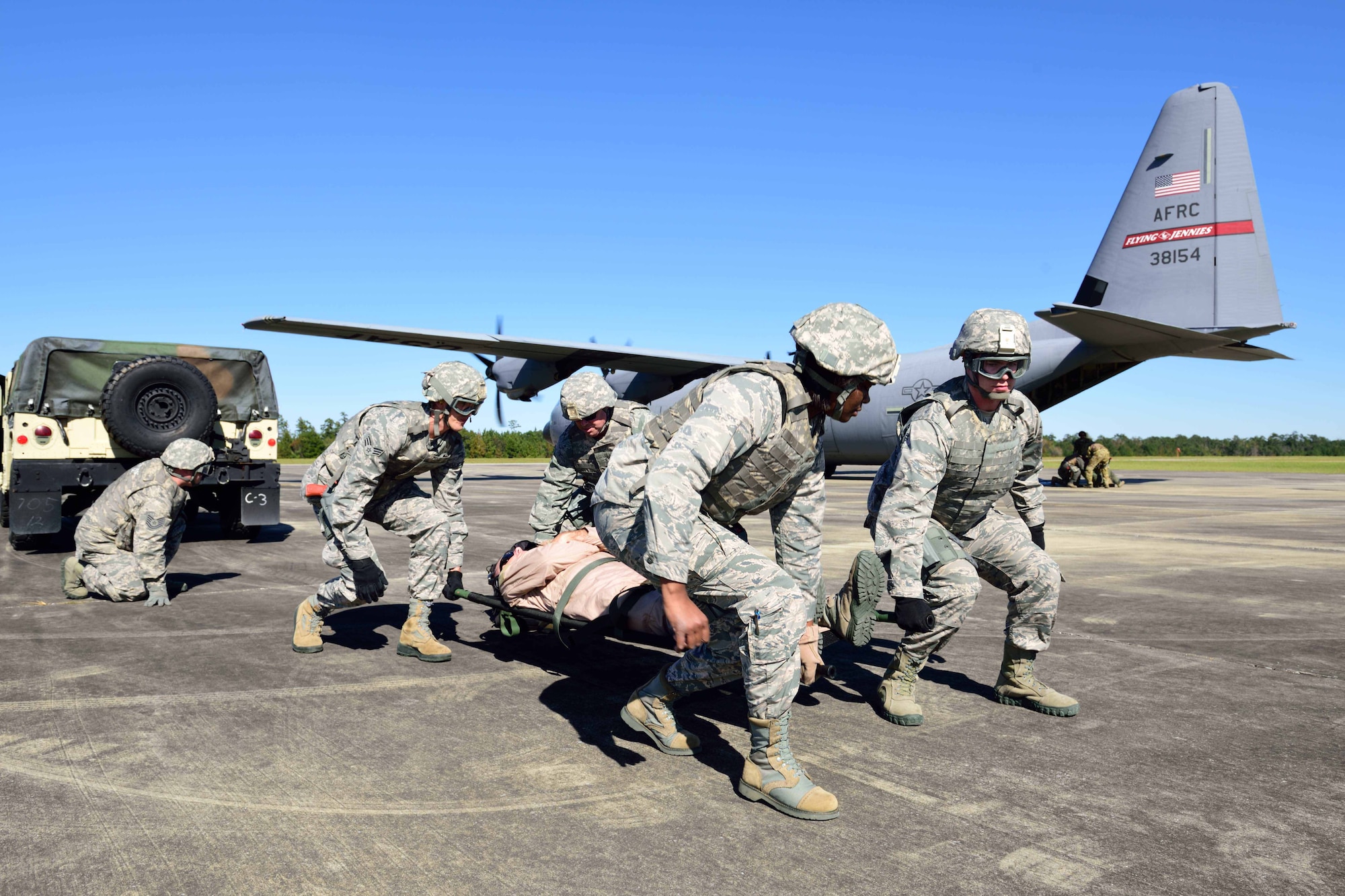 Members of the 36th Aeromedical Evacuation Squadron, which is a part of the 403rd Wing at Keesler Air Force Base, Mississippi, use a litter to carry an “injured” patient to a C-130J for aeromedical evacuation during an exercise Nov. 4, 2018, at Camp Shelby, Mississippi. The 403rd Wing participated in an exercise during the November 2018 Unit Training Assembly to test their ability to survive and operate in a deployed environment. (U.S. Air Force photo by Tech. Sgt. Ryan Labadens)