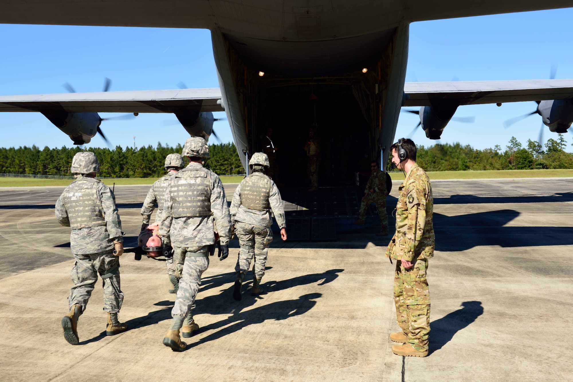 Members of the 36th Aeromedical Evacuation Squadron, which is a part of the 403rd Wing at Keesler Air Force Base, Mississippi, use a litter to carry an “injured” patient to a C-130J for aeromedical evacuation during an exercise Nov. 4, 2018, at Camp Shelby, Mississippi. The 403rd Wing participated in an exercise during the November 2018 Unit Training Assembly to test their ability to survive and operate in a deployed environment. (U.S. Air Force photo by Tech. Sgt. Ryan Labadens)