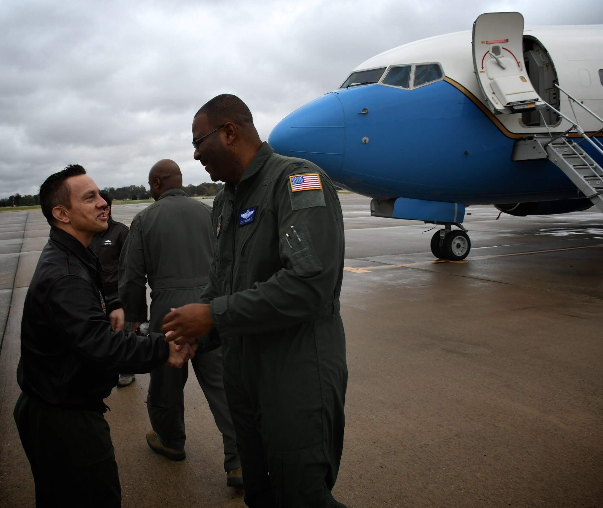 Lt. Col. Brandon Lorton, 73rd Airlift Squadron pilot, congratulates Col. Esteban  “Esty” Ramirez, the vice commander of the 932d Airlift Wing, as he exits his last C-40 flight at the 932nd Airlift Wing Nov. 4, 2018, at Scott Air Force Base, Ill. The colonel will be transferring to the U.S Transportation Command.  The wing flies the C-40C aircraft and is the premier distinguished visitor airlift operation in the Air Force Reserve Command. With over 1,000 members, the wing equips trains and organizes a ready force of Citizen Airmen to support and maintain all facets of air base operations involving infrastructure and security. (U.S. Air Force photo by Lt. Col. Stan Paregien)