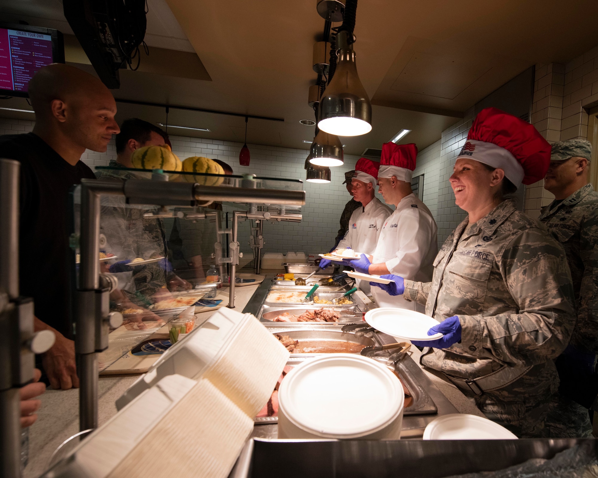 Leaders from the 141st Air Refueling Wing serve a holiday meal to Airmen at the Warrior Dining Facility Nov. 3, 2018 on Fairchild Air Force Base, Wash. As part of the holiday season, commanders, chiefs, and first sergeants volunteer their time to take part in serving a traditional holiday meal every November drill weekend. (U.S. Air National Guard photo by Staff Sgt. Rose M. Lust)