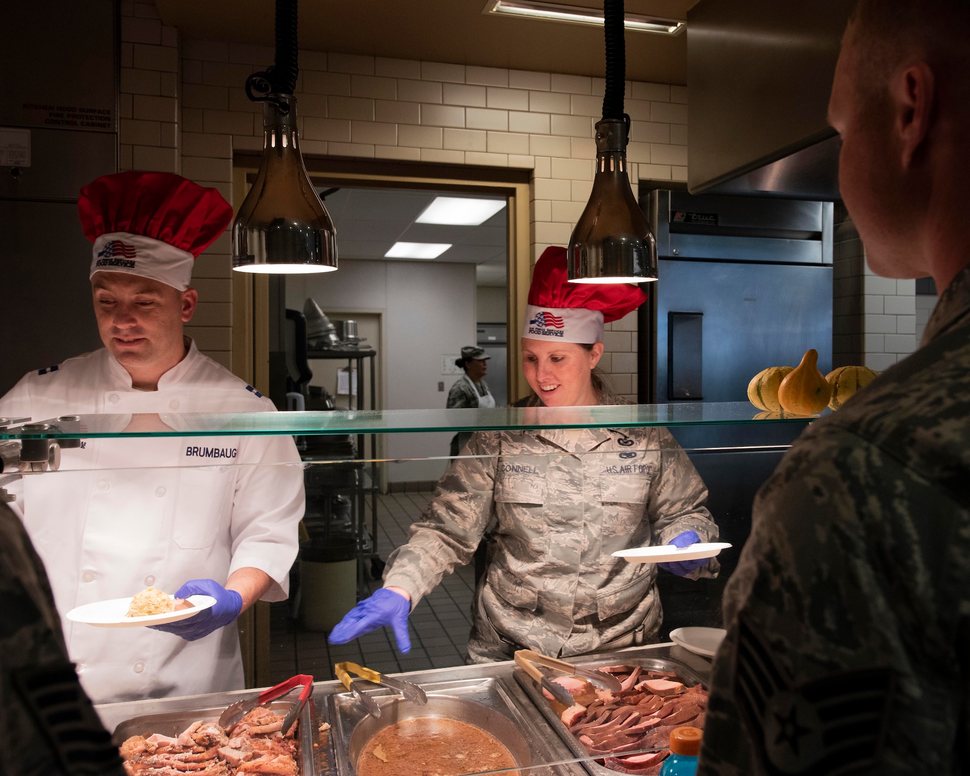 Leaders from the 141st Air Refueling Wing serve a holiday meal to Airmen at the Warrior Dining Facility Nov. 3, 2018 on Fairchild Air Force Base, Wash. As part of the holiday season, commanders, chiefs, and first sergeants volunteer their time to take part in serving a traditional holiday meal every November drill weekend. (U.S. Air National Guard photo by Staff Sgt. Rose M. Lust)