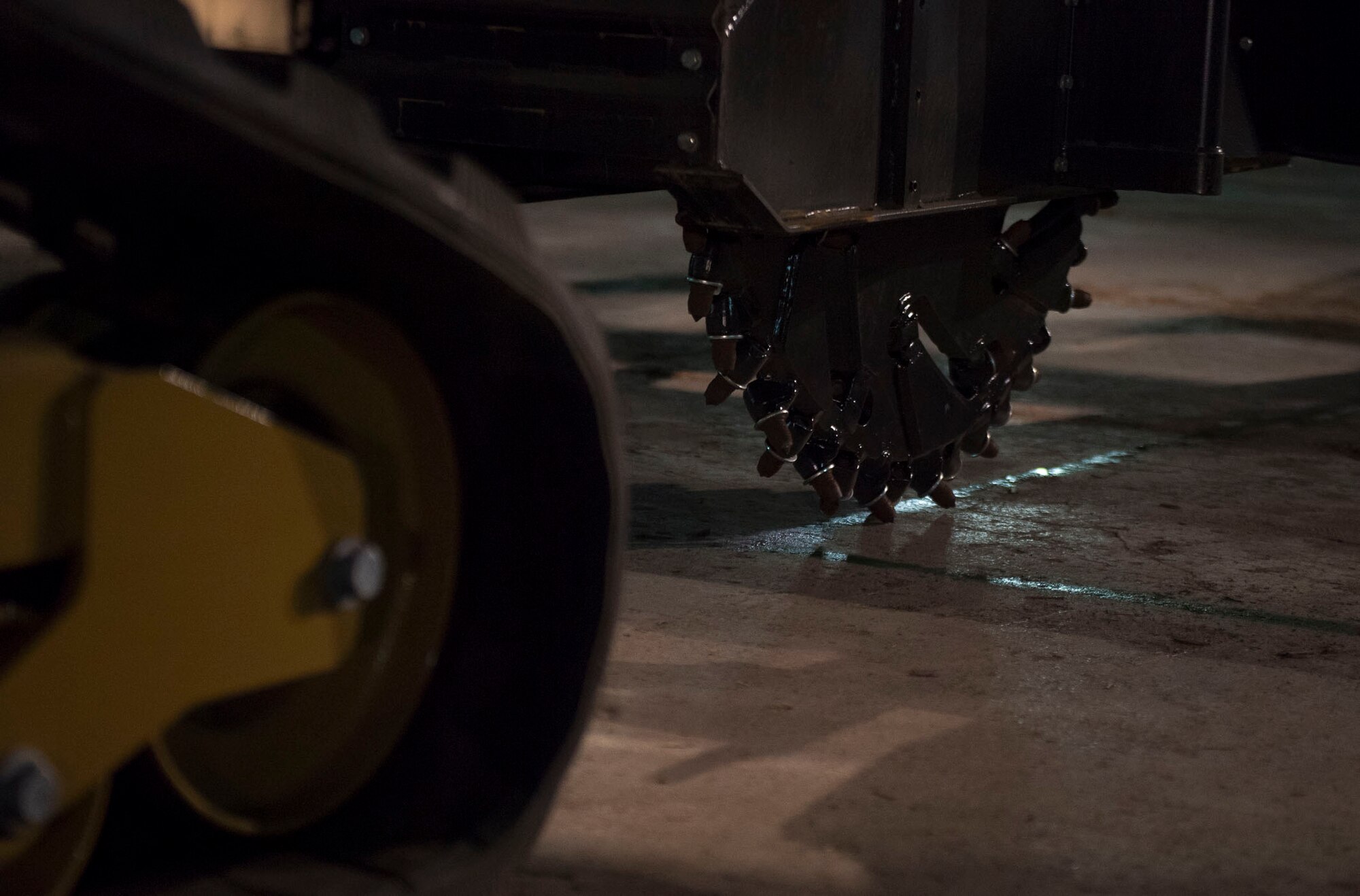 A wheel saw is prepared to cut a concrete slab, at Yokota Air Base, Japan