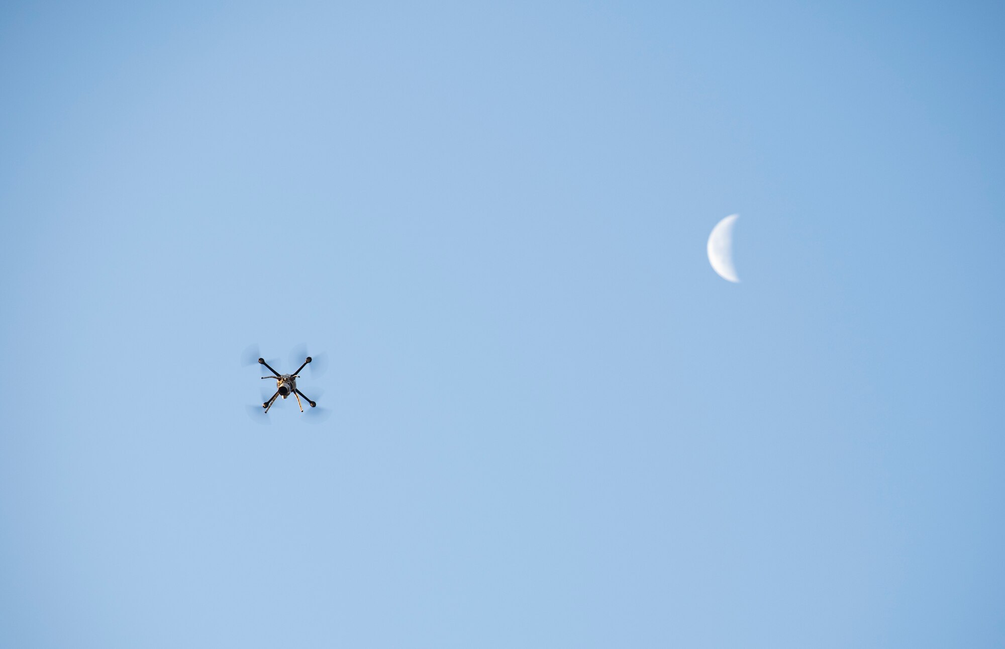 A quadcopter piloted by a 8th Civil Engineer Squadron engineering technician flies over Kunsan Air Base, Nov. 2, 2018. The 8th CES is testing the use of small, unmanned aerial systems, which give the operators a bird’s eye view of areas that need to be surveyed without putting themselves in harm’s way, to quickly and accurately perform damage assessments. (U.S. Air Force photo by Senior Airman Stefan Alvarez)