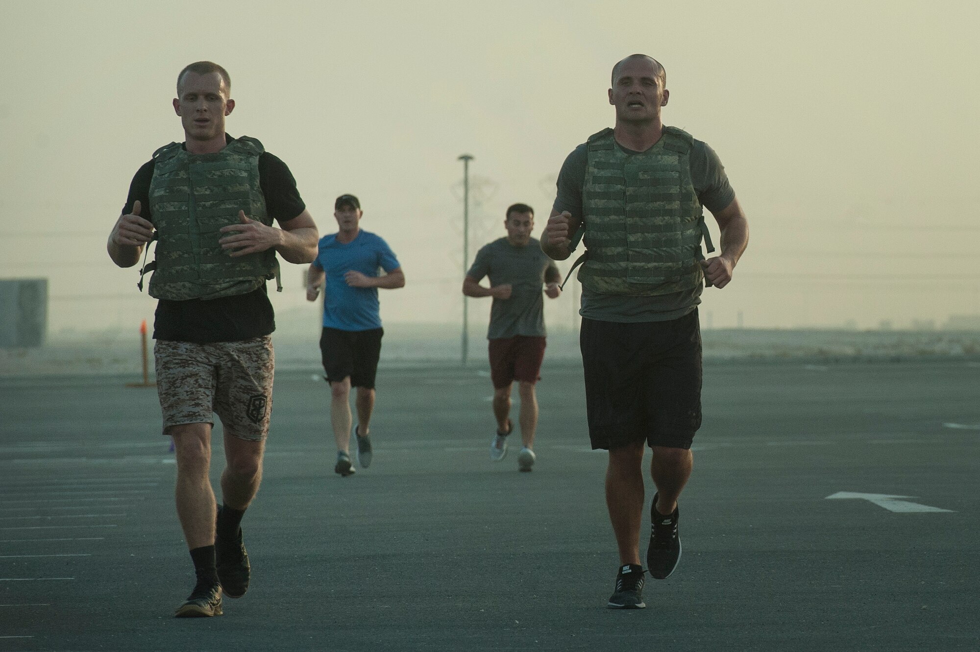 Competitors perform a 400-meter run as part of the 2018 EOD 133 Memorial Workout Nov. 4, 2018, at Al Udeid Air Base, Qatar. The event was held in honor of U.S. Army Sgt. James Slape, 430th Explosive Ordnance Company, who was killed by an improvised explosive device Oct. 4, 2018. (U.S. Air Force photo by Tech. Sgt. Christopher Hubenthal)