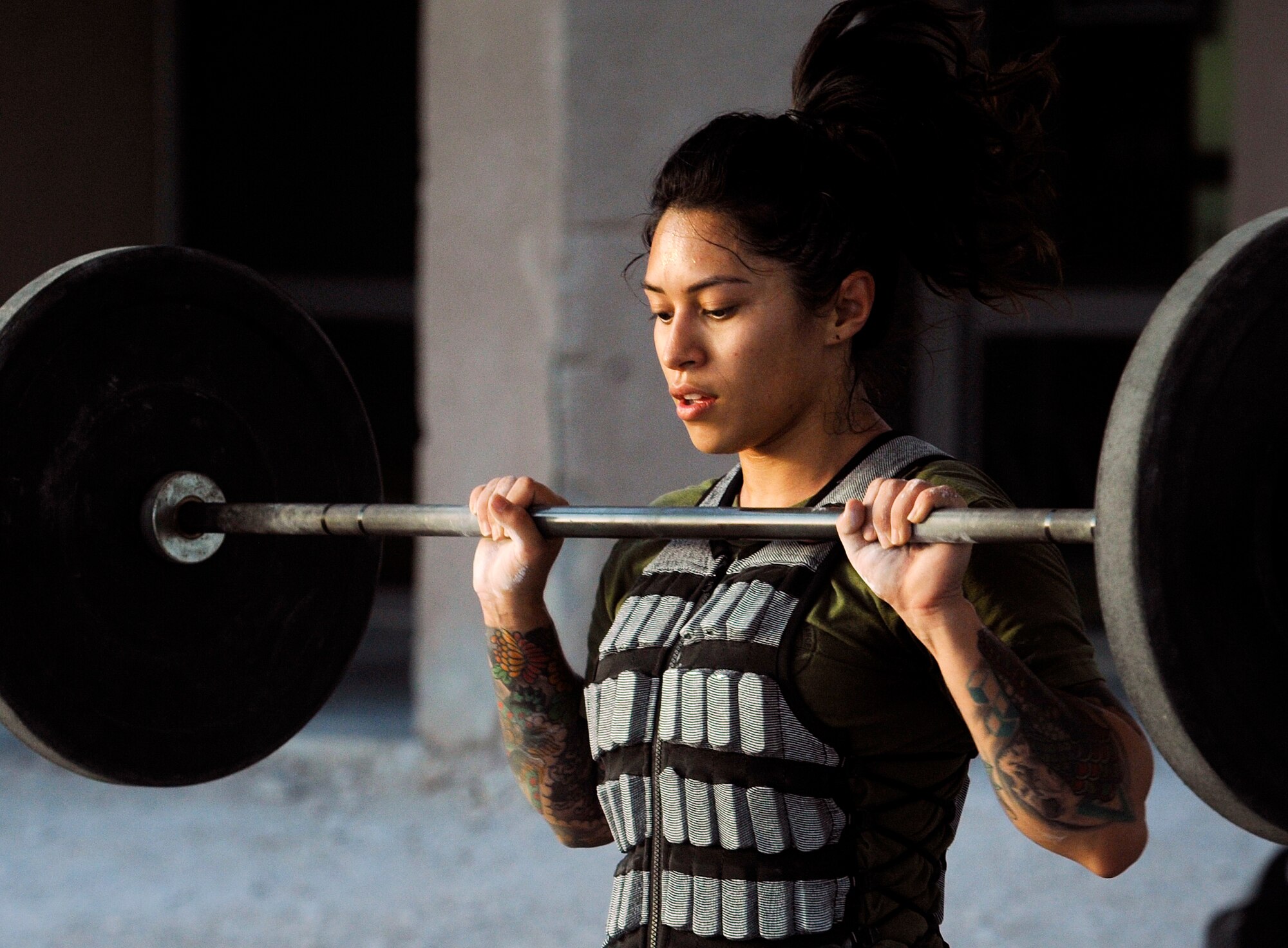 U.S. Air Force Tech. Sgt. Emily Albonetti, 746th Expeditionary Airlift Squadron intelligence analyst,  participates in the 2018 EOD 133 Memorial Workout Nov. 4, 2018, at Al Udeid Air Base, Qatar. The event was held in honor of U.S. Army Sgt. James Slape, 430th Explosive Ordnance Company, who was killed by an improvised explosive device Oct. 4, 2018. (U.S. Air Force photo by Tech. Sgt. Christopher Hubenthal)