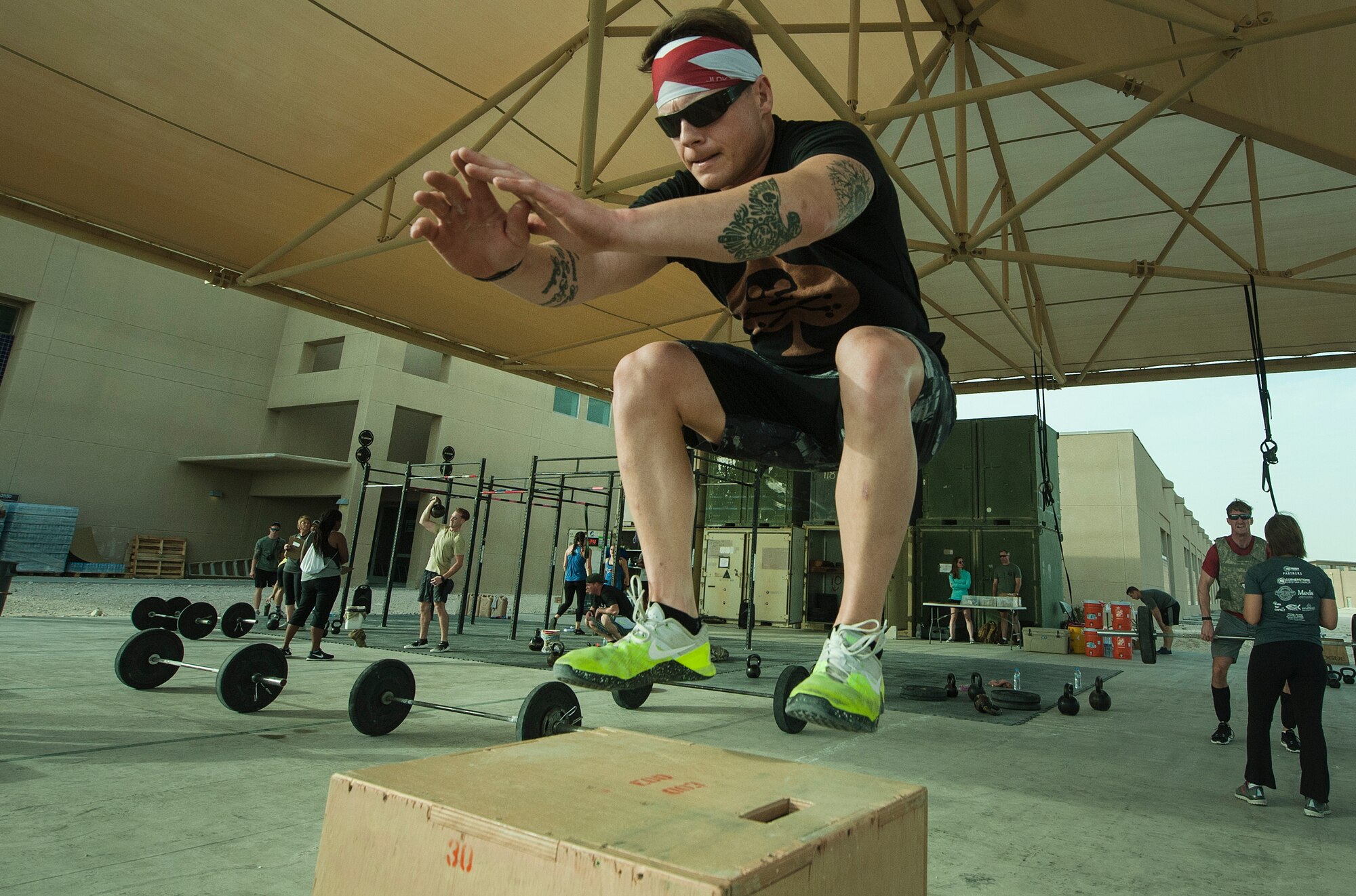 U.S. Air Force Staff Sgt. Cory Lesinger, 329th Expeditionary Civil Engineer Squadron, performs box jumps during the 2018 EOD 133 Memorial Workout Nov. 4, 2018, at Al Udeid Air Base, Qatar. The event was held in honor of U.S. Army Sgt. James Slape, 430th Explosive Ordnance Company, who was killed by an improvised explosive device Oct. 4, 2018. (U.S. Air Force photo by Tech. Sgt. Christopher Hubenthal)
