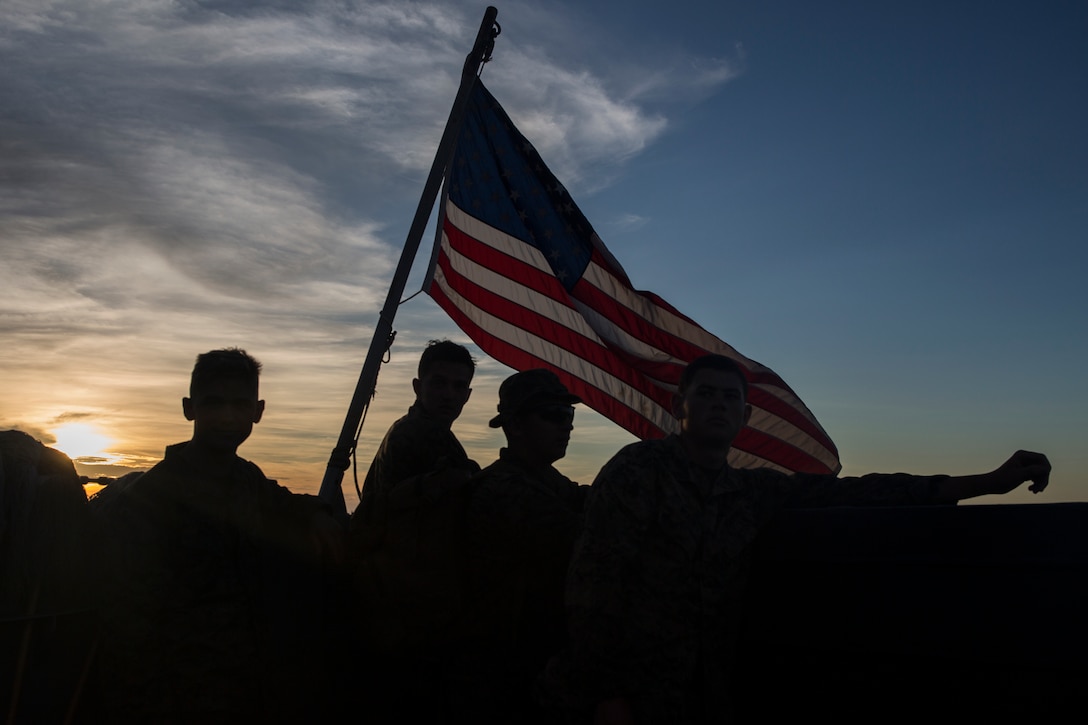 The National Ensign sways in the breeze aboard a landing craft headed toward the dock landing ship USS Ashland during U.S. Defense Support of Civil Authorities relief efforts on Tinian, Commonwealth of the Northern Mariana Islands, Nov. 3, 2018. Businesses, government buildings, homes and schools were heavily damaged by Super Typhoon Yutu, which made a direct hit with devastating effect on Tinian Oct. 25 packing 170 MPH winds – it is the second strongest storm to ever hit U.S. soil and the strongest storm of 2018. Marines with the 31st Marine Expeditionary Unit and CLB-31 have been leading a multi-service contingent since Oct. 29 as part of the U.S. Federal Emergency Management Agency-directed DSCA mission here. The Ashland arrived yesterday to deliver a larger contingent of Marines and Seabees to further assist the people of Tinian. The Marines arrived at the request of CNMI officials and FEMA to assist relief efforts in the wake of Yutu, the largest typhoon to ever hit a U.S. territory. The 31st MEU, the Marine Corps’ only continuously forward-deployed MEU, provides a flexible force ready to perform a wide-range of military operations across the Indo-Pacific region.