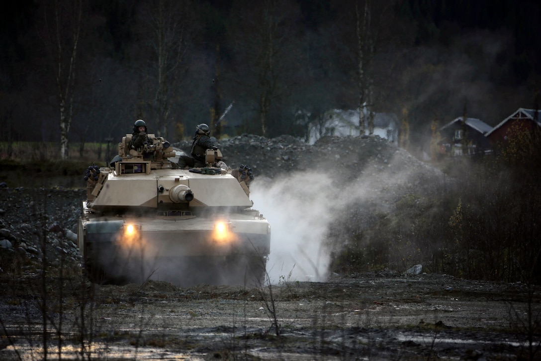 U.S. Marine Corps M1A1 Abrams tanks with 2nd Tank Battalion, 2nd Marine Division, participate in a simulated security patrol in Storas, Norway, Oct. 25, 2018. The purpose of Trident Juncture is to enhance warfighting capabilities at a large-scale level in a unique, austere environment in support of the North Atlantic Treaty Organization.
