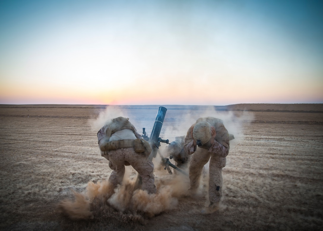 U.S. Marines with Weapons Company, 3rd Battalion, 7th Marine Regiment, attached to Special Purpose Marine Air-Ground Task Force, Crisis Response-Central Command fire 120mm mortars in support of Combined Joint Task Force – Operation Inherent Resolve operations Sept. 10, 2018. CJTF-OIR is the military arm of the Global Coalition to defeat ISIS in designated parts of Iraq and Syria.
