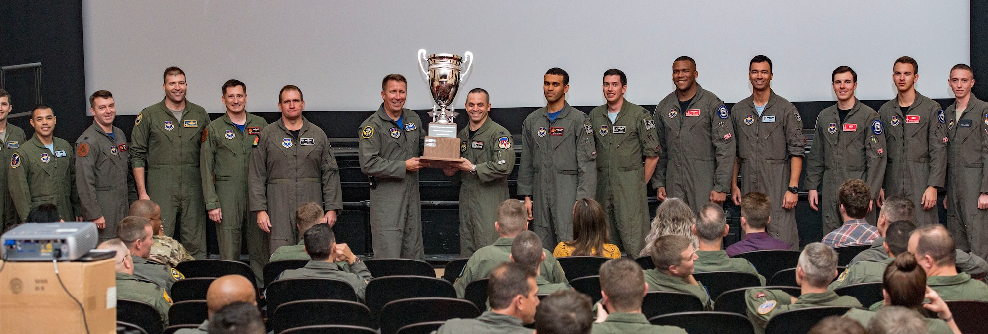 U.S. Air Force Maj. Gen. Patrick Doherty, 19th Air Force commander (center), presents the "Top Wing of Wings" award to Vance Air Force Base, Oklahoma at the 2018 Air Education and Training Command's 2018 Flying Training Awards ceremony at Joint Base San Antonio-Randolph, Texas, Oct. 26. 2018. The second annual event, hosted by the 19th Air Force, recognized the dedicated efforts of the exceptional individuals and teams across AETC who continue to produce highly qualified aircrew for the Air Force over the last fiscal year. (U.S. Air Force photo by Senior Airman Stormy Archer)