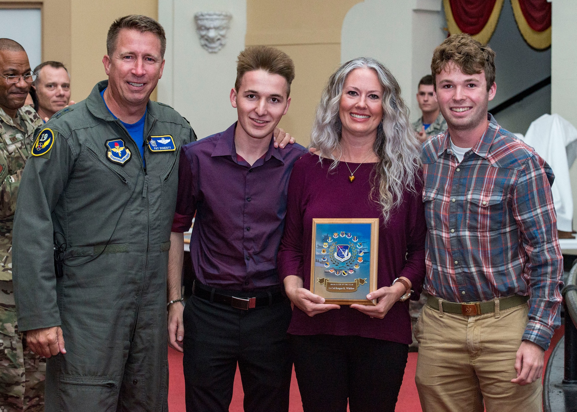 U.S. Air Force Maj. Gen. Patrick Doherty (left), 19th Air Force commander, presents a C-130H "High Flyer" award posthumously to the family of retired Lt. Col. Reagan Whitlow during the Air Education and Training Command flying training awards ceremony at Joint Base San Antonio-Randolph, Texas, Oct. 26, 2018. Whitlow, a former C-130 instructor pilot with the Arkansas Air National Guard’s 189th Airlift Wing, passed away in Sept. 2018. (U.S. Air Force photo by Senior Airman Stormy Archer)