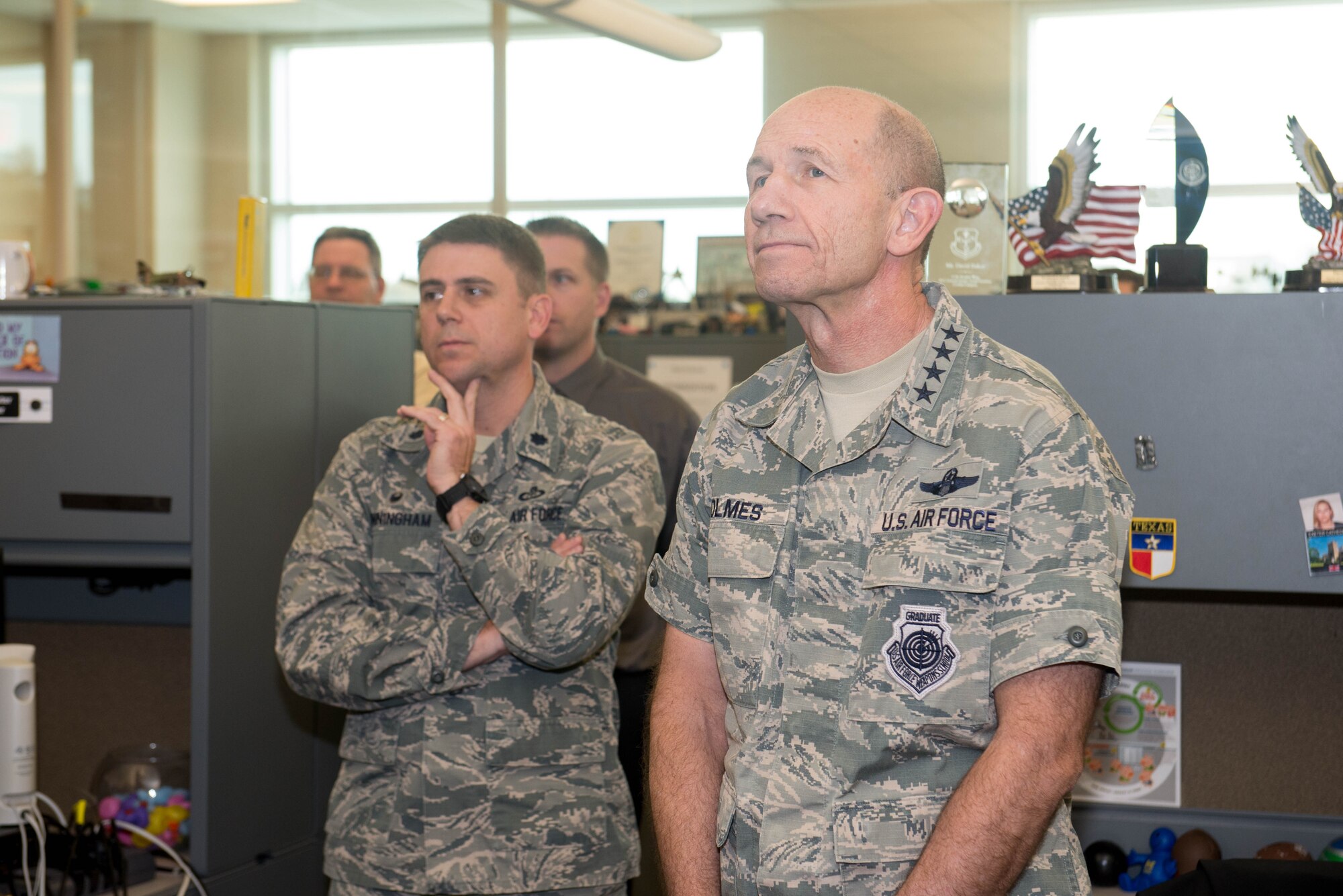 U.S. Air Force Gen. Mike Holmes, the commander of Air Combat Command, tours the 55th Weather Wing headquarters Oct. 31, 2018, at Offutt Air Force Base, Nebraska.