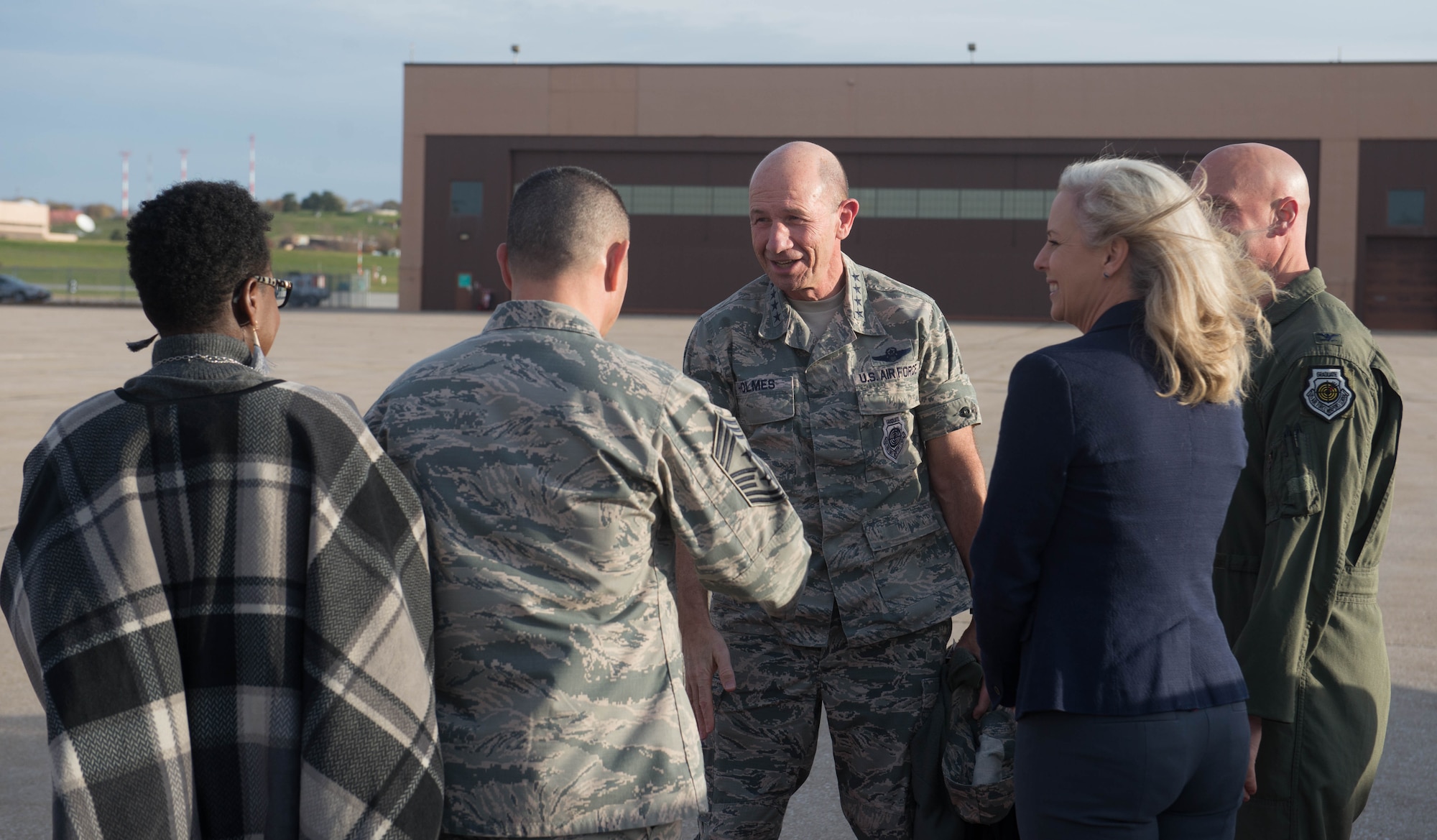 U.S. Air Force Gen. Mike Holmes, the commander of Air Combat Command, greets Chief Master Sgt. Brian Kruzelnick, 55th Wing command chief, Oct. 30, 2018, at Offutt Air Force Base, Nebraska.