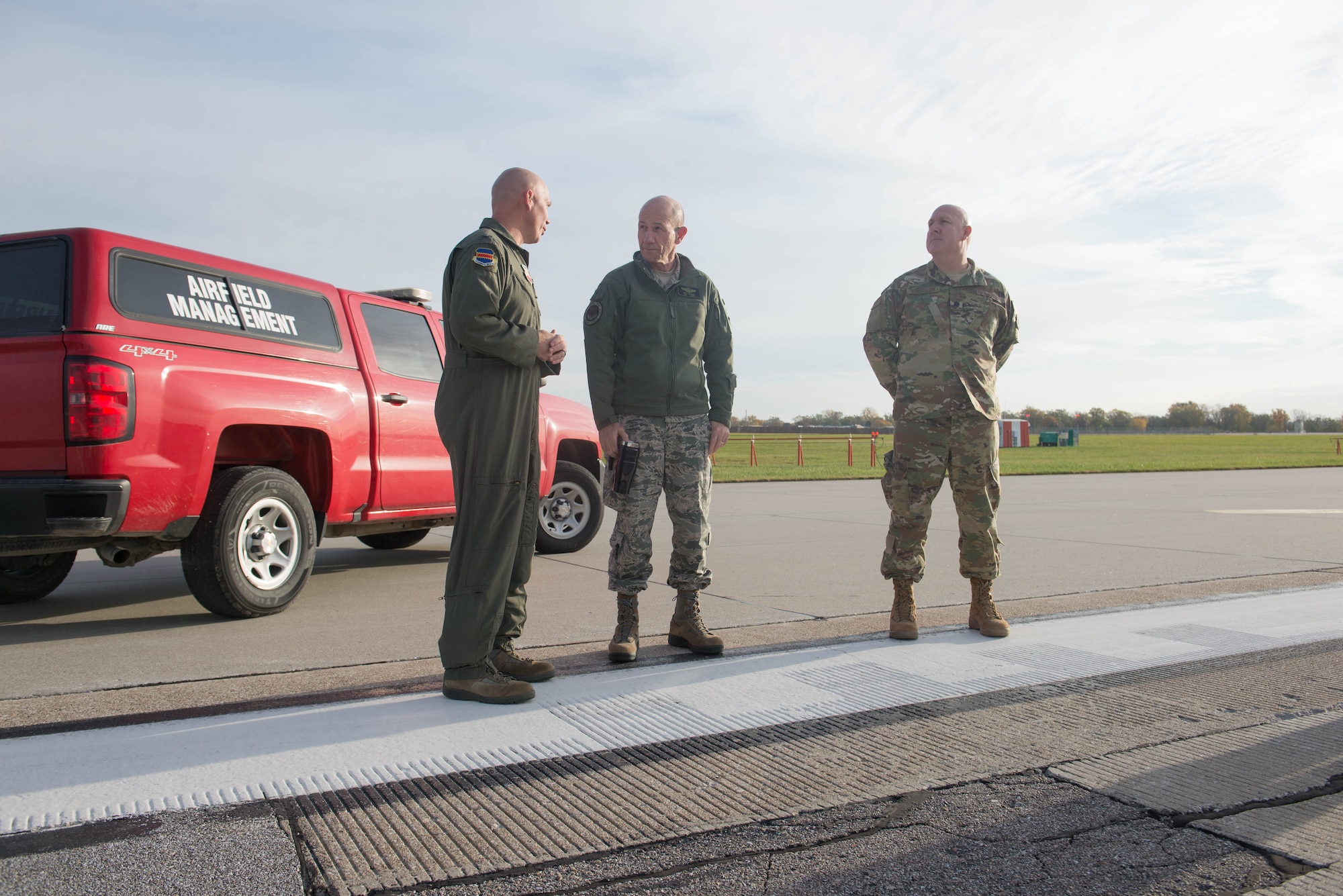 U.S. Air Force Col. Michael Manion, left, 55th Wing commander, and Gen. Mike Holmes, the commander of Air Combat Command, inspect the Offutt Air Force Base flight line Oct. 30, 2018, at Offutt AFB, Nebraska.