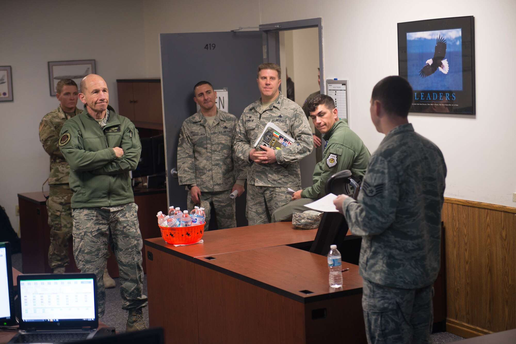 U.S. Air Force Gen. Mike Holmes, the commander of Air Combat Command, meets with the 55th Maintenance Group Emergency Management Support team in the Bennie Davis Maintenance Facility Oct. 30, 2018, at Offutt Air Force Base, Nebraska.