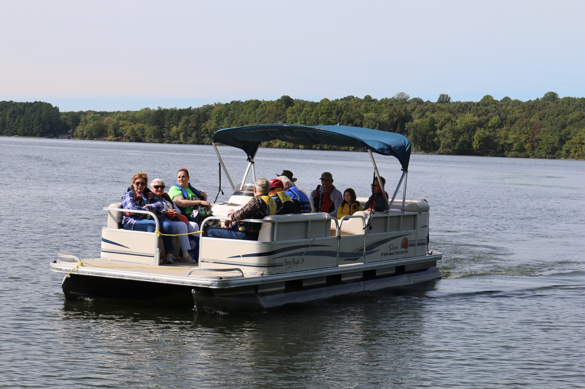 Some attendees of the Military Appreciation: Past, Present and Future Picnic spend a little time on Woods Reservoir. Boat rides were one of several activities in which picnic attendees could participate. The picnic is held annually as a way to show appreciation to past and present service members and their families. (U.S. Air Force photo by Bradley Hicks)
