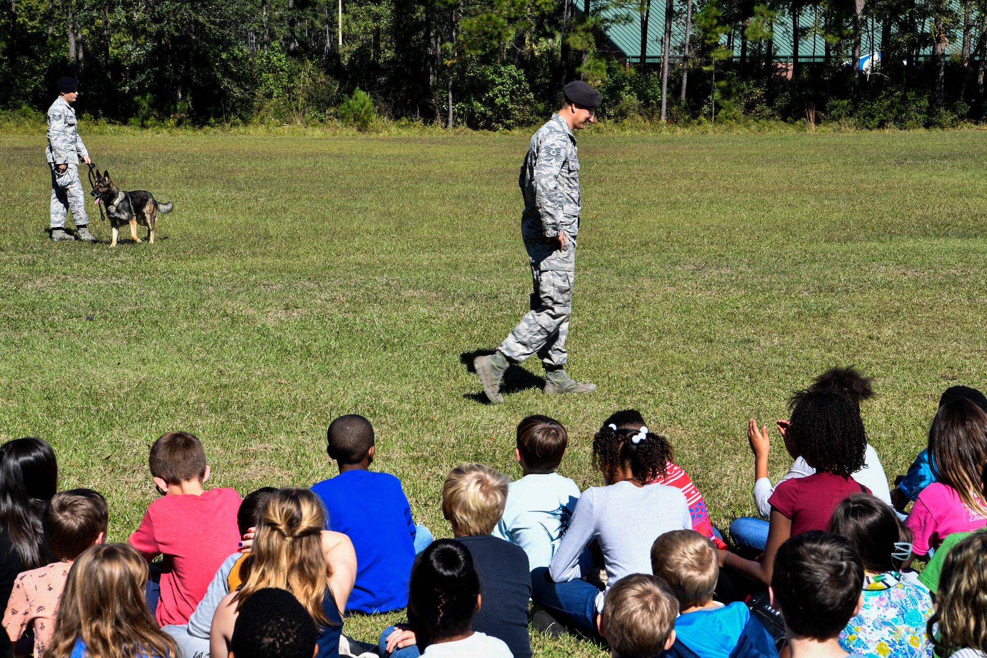 Kids from the Merrington Elementary School watch a K9 demonstration Oct. 29, 2018 at Joint Base Charleston, S.C.
