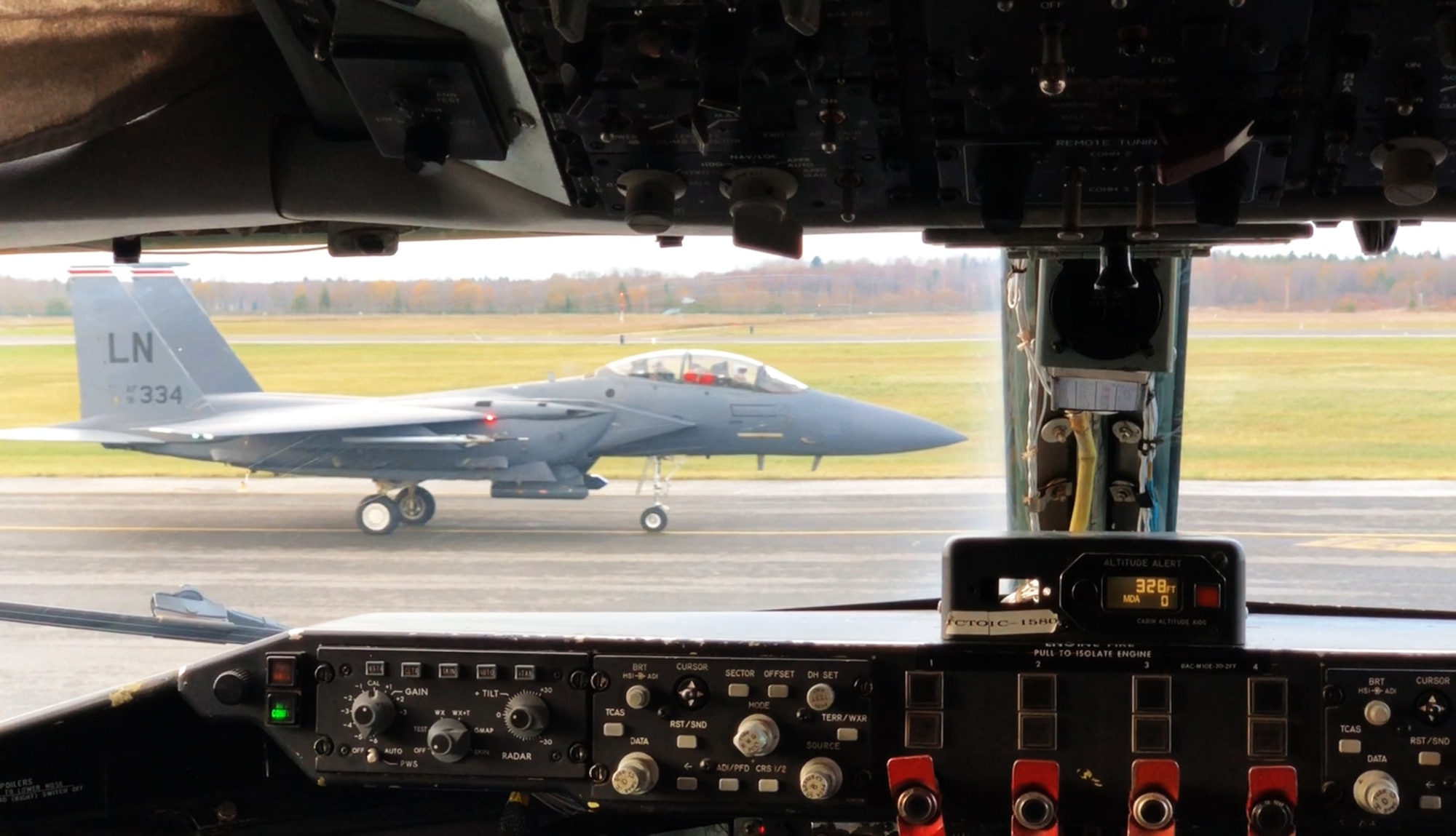 A U.S. Air Force F-15E Strike Eagle with the 48th Fighter Wing from RAF Lakenheath, England, lands in front of a parked U.S. Air Force KC-135 Stratotanker with the 100th Air Refueling Wing from RAF Mildenhall, England, during a deployment to Ӓmari Air Base, Estonia, Nov. 1, 2018. The Strike Eagles tested the airfield’s BAK-14 cable arresting system, which is used to safely bring fighter aircraft to a stop in the event of an emergency. (U.S. Air Force photo by Senior Airman Kelly O’Connor)