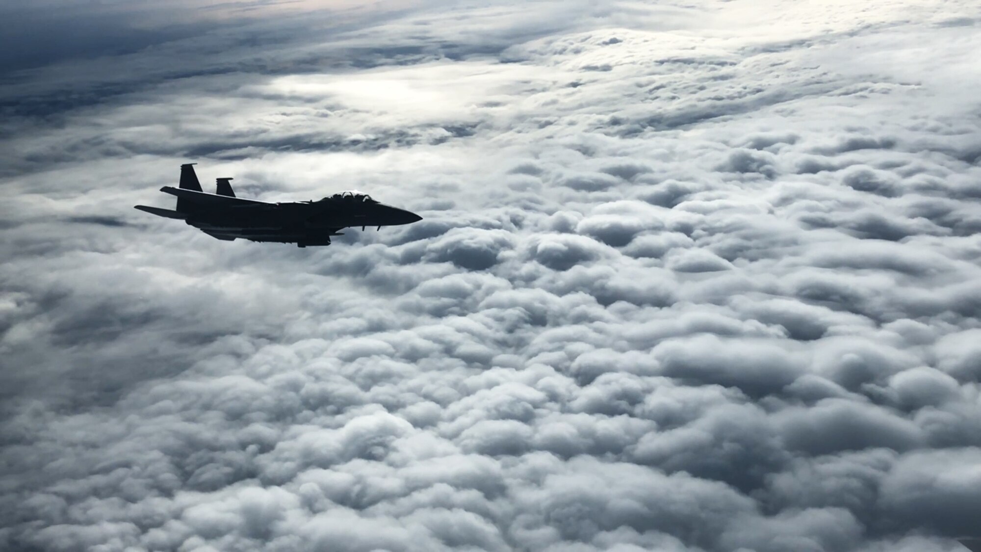 A U.S. Air Force F-15E Strike Eagle with the 48th Fighter Wing from RAF Lakenheath, England, flies beside a U.S. Air Force KC-135 Stratotanker with the 100th Air Refueling Wing from RAF Mildenhall, England, during a deployment to Ӓmari Air Base, Estonia, Nov. 1, 2018. Estonia is a key NATO ally in Europe and a strong U.S. partner in fostering regional security and prosperity. (U.S. Air Force photo by Senior Airman Kelly O’Connor)
