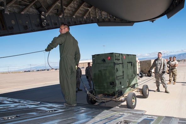 A C-17 Globemaster III operated by the 167th Airlift Wing is loaded with six generators and a Large Area Maintenance Shelter (LAMS) from the 635th Materiel Maintenance Squadron based at Holloman Air Force Base N.M., Oct. 17, 2018. The C-17 deliever the equipment to Tyndall AFB the following day with the assistance of a contingency response team from the 821st Contingency Response Group, Travis AFB, Calif. Tyndall AFB took a direct hit from Hurricane Michael, which made landfall as a category 4 storm on Oct. 10. The 635th Materiel Maintenance Group is the Air Force’s only organic Basic Expeditionary Airfield Resources (BEAR) unit. The Group is responsible for the storage, inspection, repair, deployment, and accountability of BEAR assets belonging to Air Force Materiel Command and Air Combat Command. (U.S. Air National Guard photo by Senior Master Sgt. Emily Beightol-Deyerle)