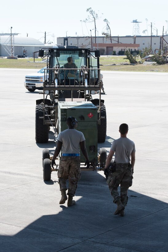 A C-17 Globemaster III operated by the 167th Airlift Wing transported six generators and a Large Area Maintenance Shelter (LAMS) from the 635th Materiel Maintenance Squadron based at Holloman Air Force Base N.M., to Tyndall Air Force Base, Fla., Oct. 18, 2018. The C-17 air crew, with assistance from the 635th MMS, loaded the cargo Oct. 17. The following day the cargo was unloaded at Tyndall AFB with the assistance of a contingency response team from the 821st Contingency Response Group, Travis AFB, Calif. Tyndall AFB took a direct hit from Hurricane Michael, which made landfall as a category 4 storm on Oct. 10. The 635th Materiel Maintenance Group is the Air Force’s only organic Basic Expeditionary Airfield Resources (BEAR) unit. The Group is responsible for the storage, inspection, repair, deployment, and accountability of BEAR assets belonging to Air Force Materiel Command and Air Combat Command. (U.S. Air National Guard photo by Senior Master Sgt. Emily Beightol-Deyerle)