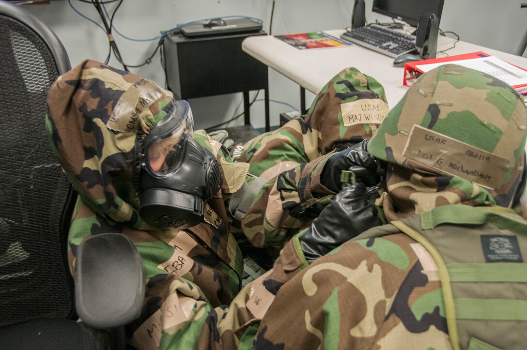 Members of the 104th Fighter Wing participated in a Phase II exercise November 3, 2018, at Barnes Air National Guard base, Westfield, Massachusetts. Colonel Pete Green, commander of the 104th FW, convened a Crisis Action Team consisting of group-level commanders and other pertinent subject-matter experts. During Alarm Black, Mission Oriented Protective Posture four, members of the CAT team worked together to get their gear on safe and securely in under two minutes.  (U.S. Air National Guard photo/ 2Lt. Amelia Leonard. Cleared for public release)