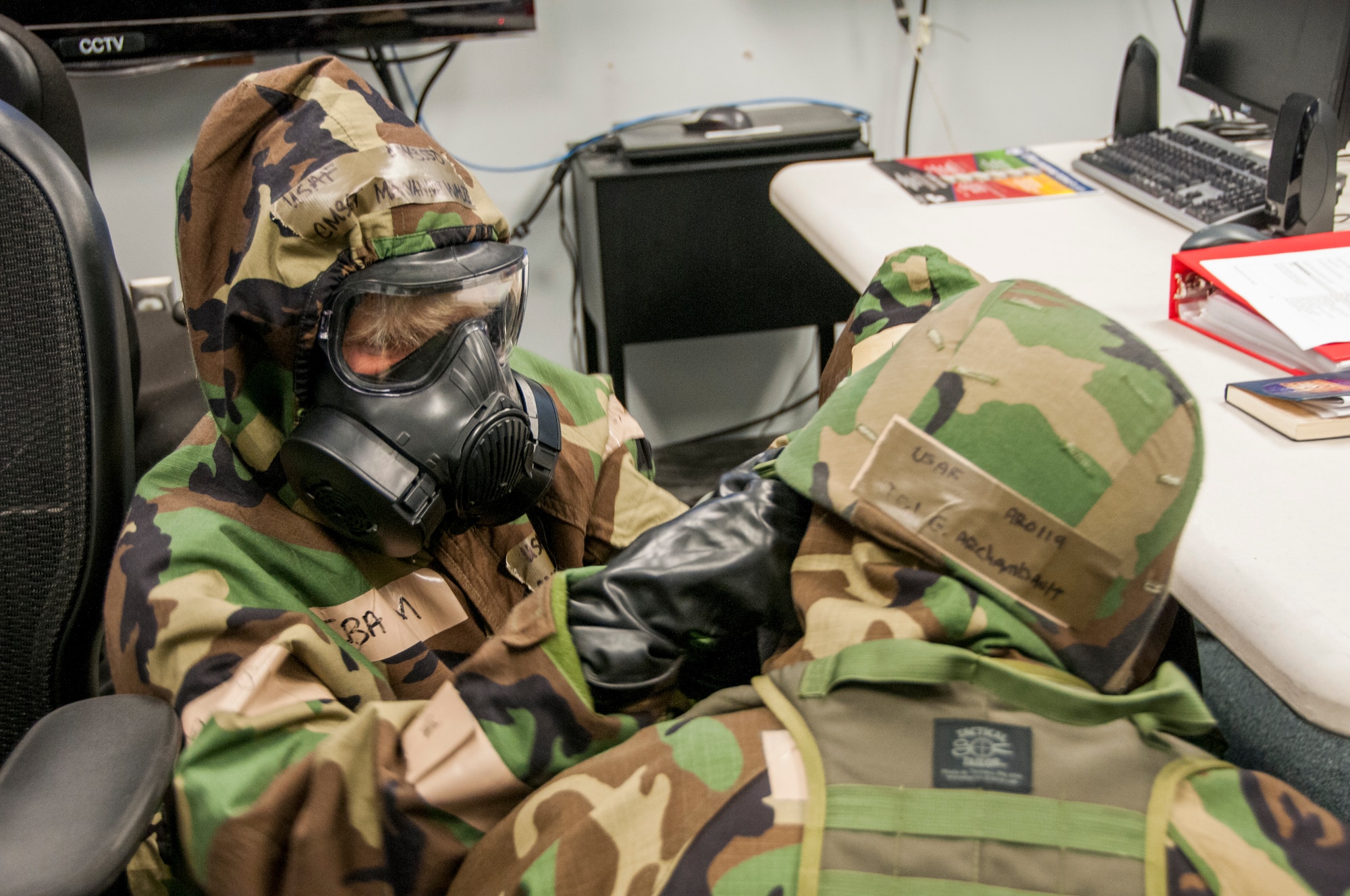 Members of the 104th Fighter Wing participated in a Phase II exercise November 3, 2018, at Barnes Air National Guard base, Westfield, Massachusetts. Colonel Pete Green, commander of the 104th FW, convened a Crisis Action Team consisting of group-level commanders and other pertinent subject-matter experts. During Alarm Black, Mission Oriented Protective Posture four, members of the CAT team worked together to get their gear on safe and securely in under two minutes.  (U.S. Air National Guard photo/ 2Lt. Amelia Leonard. Cleared for public release)