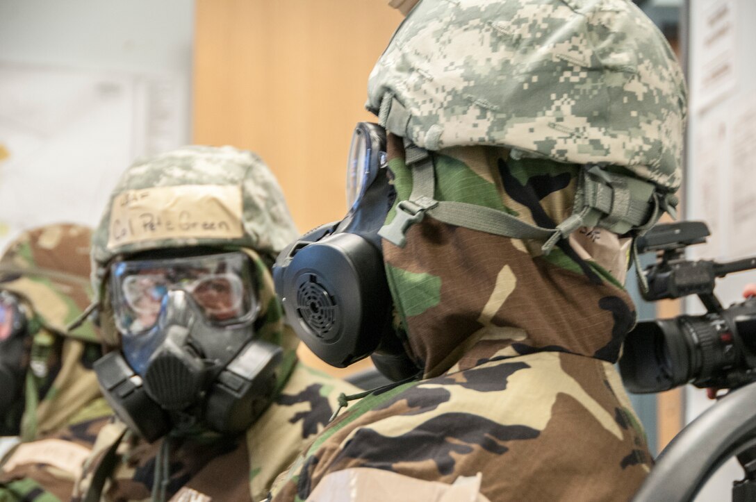 Members of the 104th Fighter Wing participated in a Phase II exercise November 3, 2018, at Barnes Air National Guard base, Westfield, Massachusetts. Colonel Pete Green, commander of the 104th FW, convened a Crisis Action Team consisting of group-level commanders and other pertinent subject-matter experts. During Alarm Black, Mission Oriented Protective Posture four, members of the CAT team worked together to get their gear on safe and securely in under two minutes.  (U.S. Air National Guard photo/ 2Lt. Amelia Leonard. Cleared for public release)