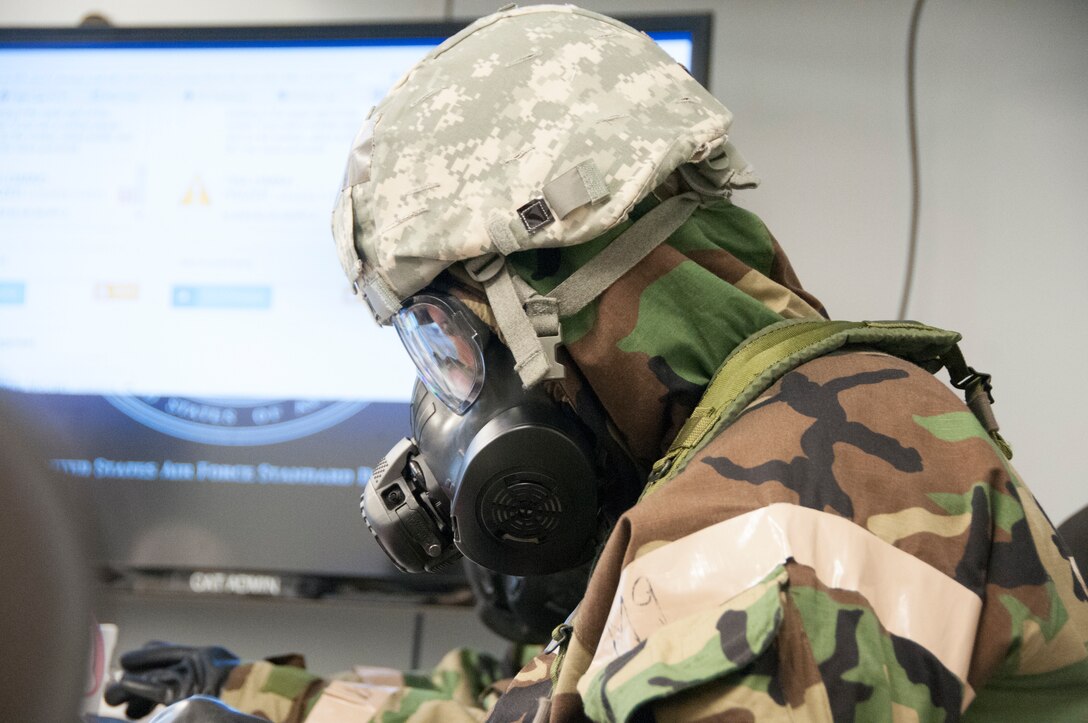 Members of the 104th Fighter Wing participated in a Phase II exercise November 3, 2018, at Barnes Air National Guard base, Westfield, Massachusetts. Colonel Pete Green, commander of the 104th FW, convened a Crisis Action Team consisting of group-level commanders and other pertinent subject-matter experts. During Alarm Black, Mission Oriented Protective Posture four, members of the CAT team worked together to get their gear on safe and securely in under two minutes.  (U.S. Air National Guard photo/ 2Lt. Amelia Leonard. Cleared for public release)