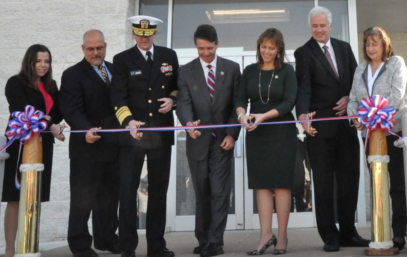 IMAGE: DAHLGREN, Va. (Nov. 1, 2018) - Navy leaders and scientists are joined by local officials at the ribbon cutting ceremony for the new Naval Surface Warfare Center Dahlgren Division (NSWCDD) Missile Support Facility. The facility features state-of-the-art labs, offices, and equipment for more than 300 NSWCDD Strategic and Computing Systems Department scientists, engineers, and technical experts who develop, test, and maintain the Submarine Launched Ballistic Missile fire control and mission planning software. From left to right: Lauren Falkenstein, a scientist representing the NSWCDD Strategic and Computing Systems Department's newly-hired junior workers; John Fiore, NSWCDD technical director; Vice Adm. Johnny Wolfe, director of Navy Strategic Systems Programs; U.S. Rep. Rob Wittman; Margaret Ransone, Virginia delegate; Kyle Jones, head of the NSWCDD Strategic and Computing Systems Department; Lisa Weisbeck, a scientist representing the NSWCDD Strategic and Computing Systems Department's senior level workers.