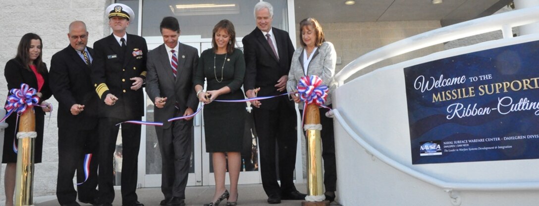 IMAGE: DAHLGREN, Va. (Nov. 1, 2018) - Navy leaders and scientists are joined by local officials at the ribbon cutting ceremony for the new Naval Surface Warfare Center Dahlgren Division (NSWCDD) Missile Support Facility. The facility features state-of-the-art labs, offices, and equipment for more than 300 NSWCDD Strategic and Computing Systems Department scientists, engineers, and technical experts who develop, test, and maintain the Submarine Launched Ballistic Missile fire control and mission planning software. From left to right: Lauren Falkenstein, a scientist representing the NSWCDD Strategic and Computing Systems Department's newly-hired junior workers; John Fiore, NSWCDD technical director; Vice Adm. Johnny Wolfe, director of Navy Strategic Systems Programs; U.S. Rep. Rob Wittman; Margaret Ransone, Virginia delegate; Kyle Jones, head of the NSWCDD Strategic and Computing Systems Department; Lisa Weisbeck, a scientist representing the NSWCDD Strategic and Computing Systems Department's senior level workers.