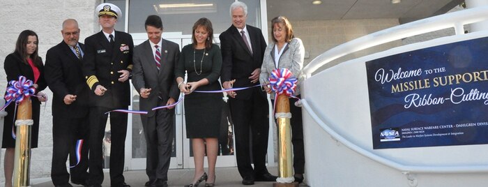 IMAGE: DAHLGREN, Va. (Nov. 1, 2018) - Navy leaders and scientists are joined by local officials at the ribbon cutting ceremony for the new Naval Surface Warfare Center Dahlgren Division (NSWCDD) Missile Support Facility. The facility features state-of-the-art labs, offices, and equipment for more than 300 NSWCDD Strategic and Computing Systems Department scientists, engineers, and technical experts who develop, test, and maintain the Submarine Launched Ballistic Missile fire control and mission planning software. From left to right: Lauren Falkenstein, a scientist representing the NSWCDD Strategic and Computing Systems Department's newly-hired junior workers; John Fiore, NSWCDD technical director; Vice Adm. Johnny Wolfe, director of Navy Strategic Systems Programs; U.S. Rep. Rob Wittman; Margaret Ransone, Virginia delegate; Kyle Jones, head of the NSWCDD Strategic and Computing Systems Department; Lisa Weisbeck, a scientist representing the NSWCDD Strategic and Computing Systems Department's senior level workers.