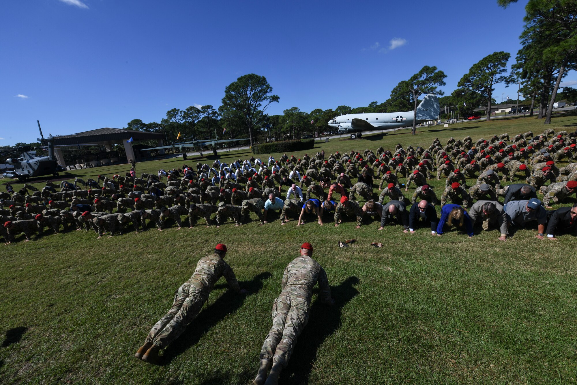 Hundreds of Air Commandos, family members and guests perform memorial pushups in honor of U.S. Air Force Master Sgt. John Chapman on Oct. 27, 2018, at Hurlburt Field, Florida.