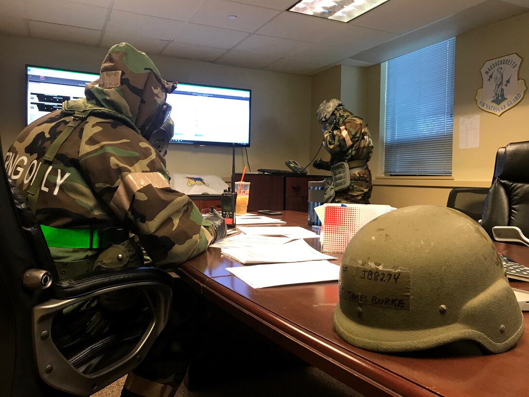 Airmen from the 104th Fighter Wing work in Mission Oriented Protective Posture level four Nov. 4, 2018, at Barnes Air National Guard Base, Massachusetts. The airmen kept morale high while working to enhance mission readiness.  (U.S. National Guard photo by Airman Basic Sara Kolinski)
