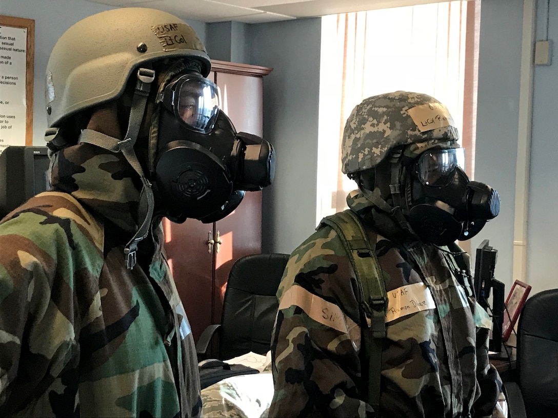 Airmen from the 104th Fighter Wing work in Mission Oriented Protective Posture level four Nov. 4, 2018, at Barnes Air National Guard Base, Massachusetts. The airmen kept morale high while working to enhance mission readiness.  (U.S. National Guard photo by Airman Basic Sara Kolinski)