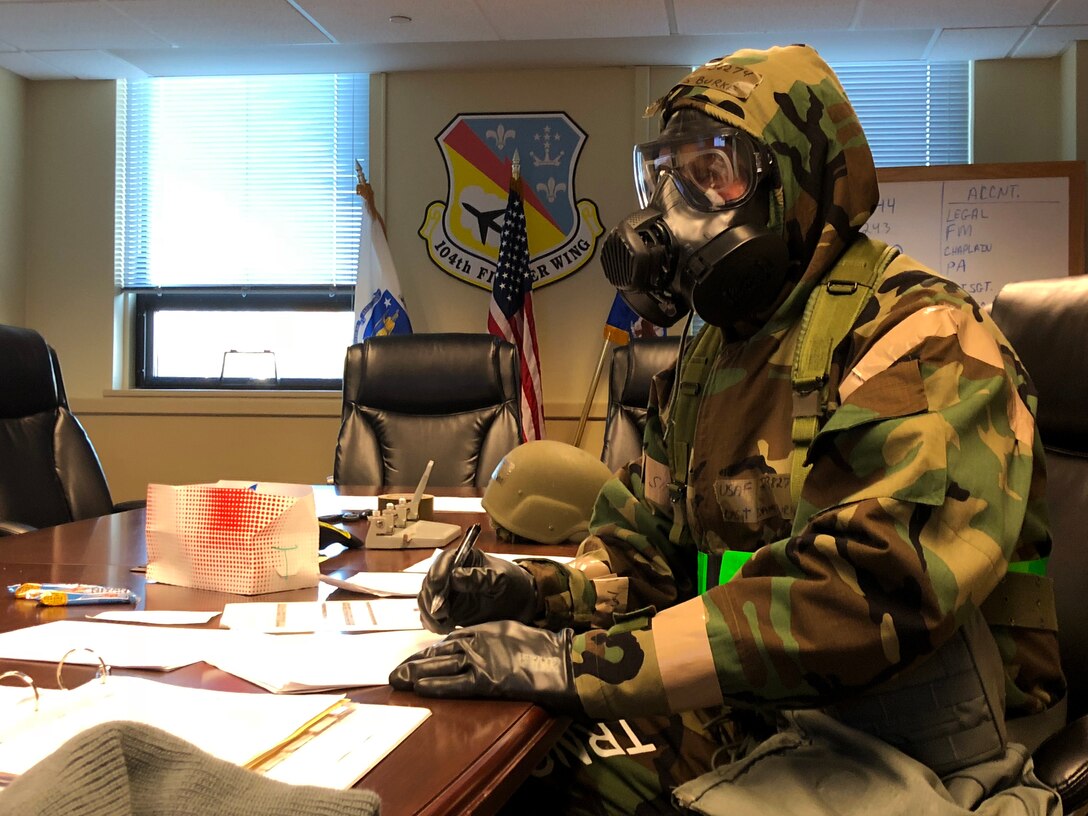 Airmen from the 104th Fighter Wing work in Mission Oriented Protective Posture level four Nov. 4, 2018, at Barnes Air National Guard Base, Massachusetts. The airmen kept morale high while working to enhance mission readiness.  (U.S. National Guard photo by 2Lt. Amelia Leonard. Cleared for public release)