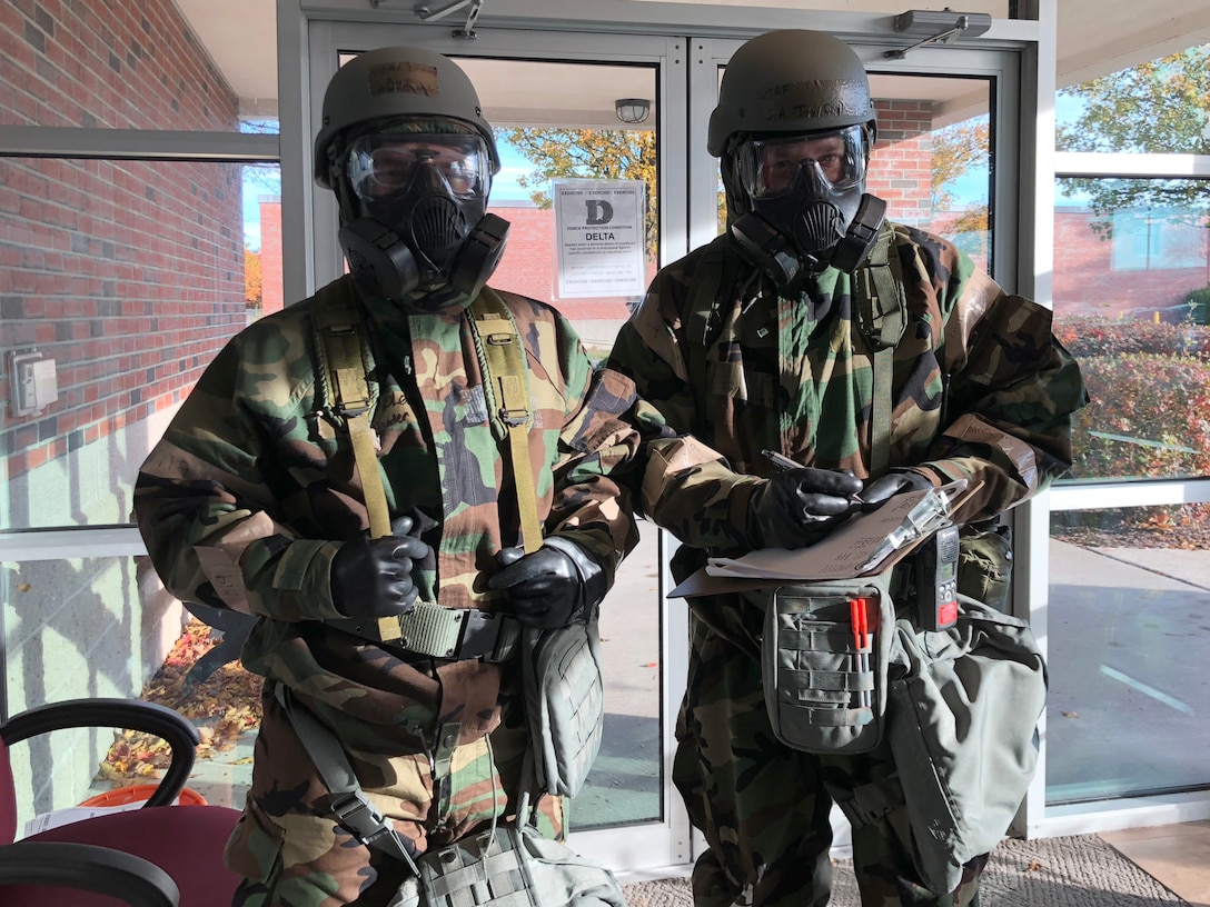 Airmen from the 104th Fighter Wing work in Mission Oriented Protective Posture level four Nov. 4, 2018, at Barnes Air National Guard Base, Massachusetts. The airmen kept morale high while working to enhance mission readiness.  (U.S. National Guard photo by 2Lt. Amelia Leonard. Cleared for public release)