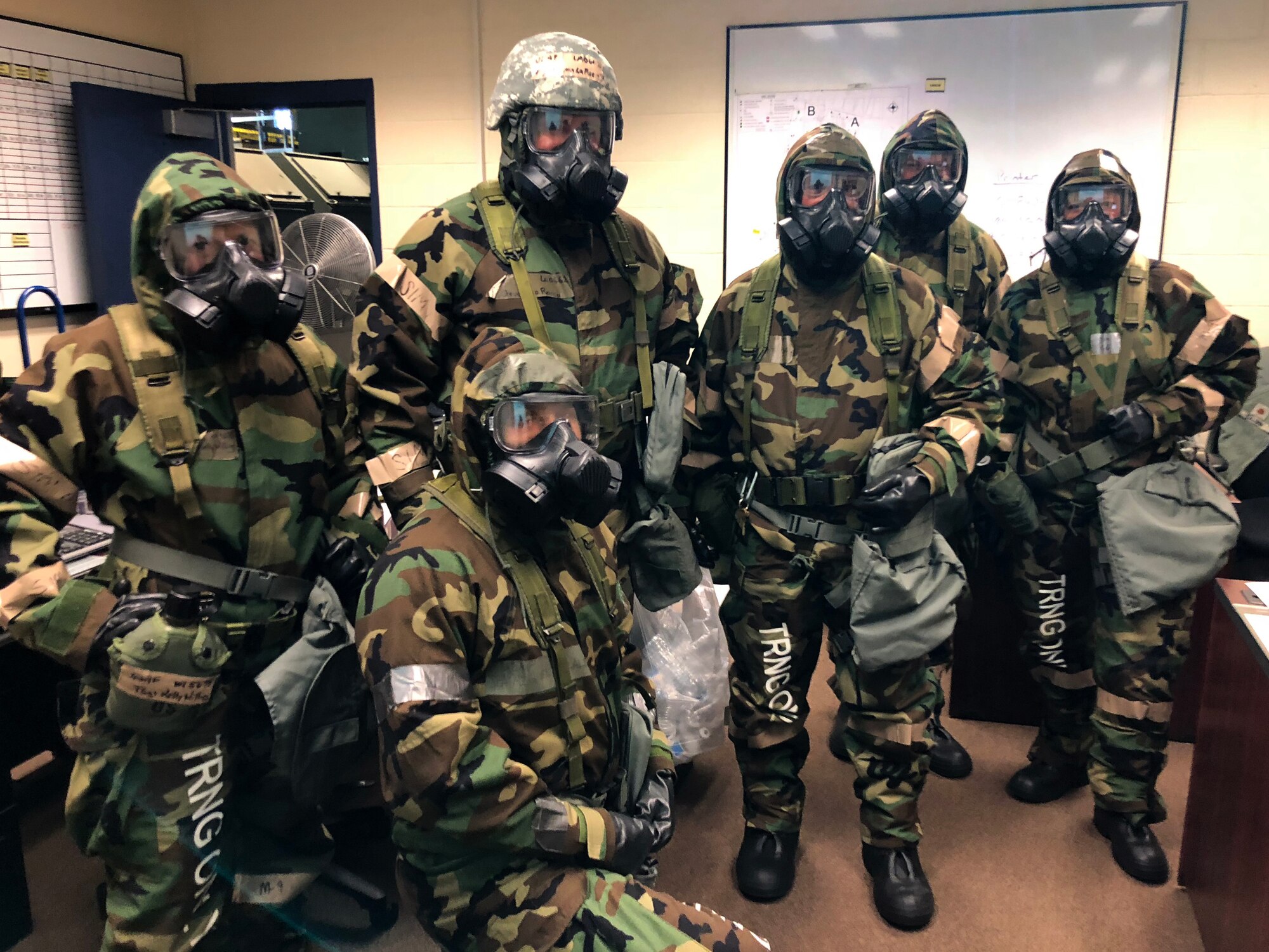 Airmen from the 104th Fighter Wing work in Mission Oriented Protective Posture level four Nov. 4, 2018, at Barnes Air National Guard Base, Massachusetts. The airmen kept morale high while working to enhance mission readiness.  (U.S. National Guard photo by 2Lt. Amelia Leonard. Cleared for public release)