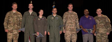 Col. Clint ZumBrunnen, left, 437th Airlift Wing commander and Command Chief Master Sgt. Ronnie Phillips Jr., right, 437th AW command chief, stand with the third quarter award winners Nov. 1, 2018, at the Air Base Theater. The ceremony recognized a few outstanding Airmen, NCOs, senior NCOs, company grade officers, field grade officers and civilians on their hard work, dedication and superior performance.