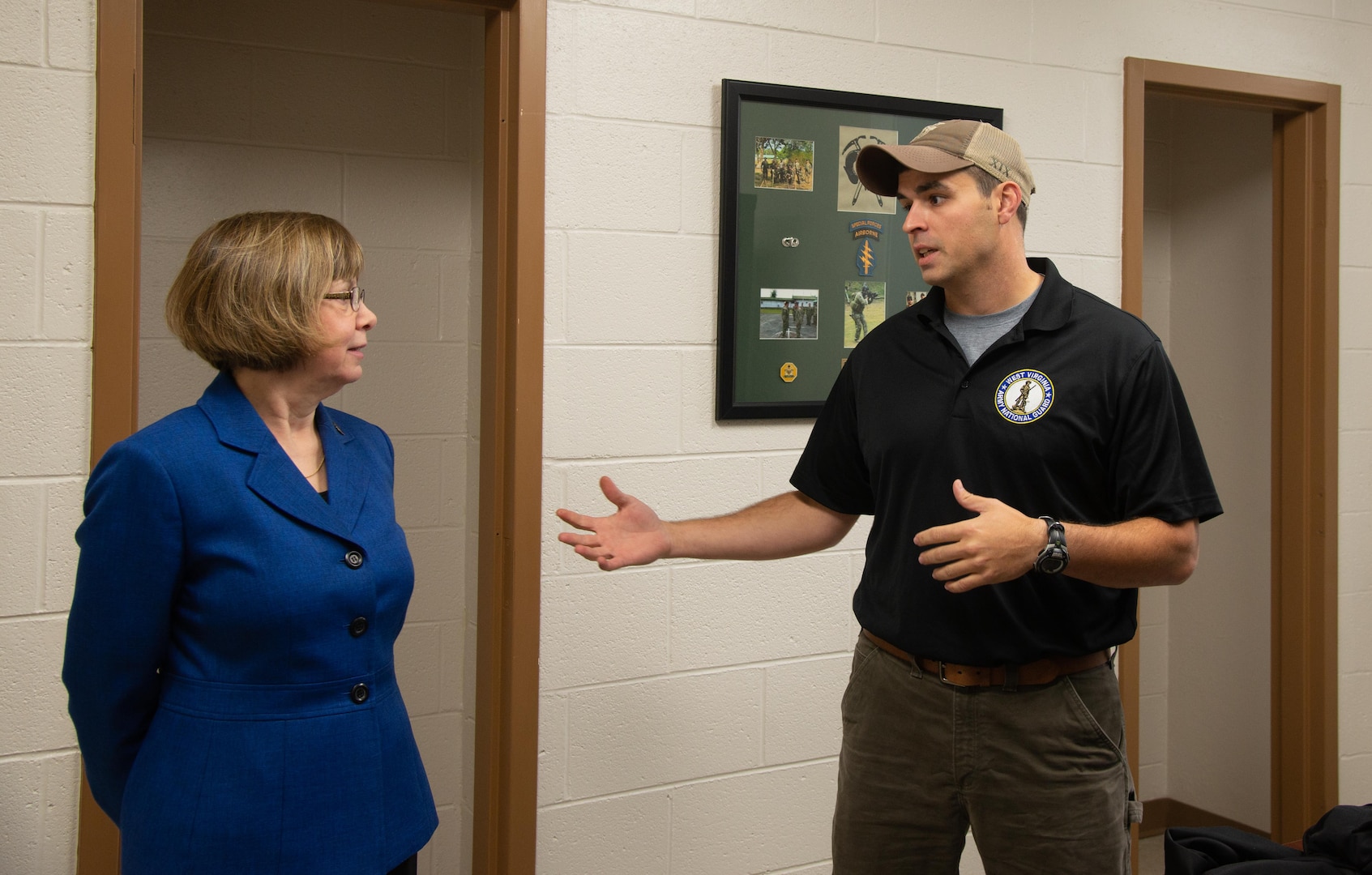 Bluefield State College President Marsha Krotseng speaks with Sgt. 1st Class Teddy Scouras, a recruiter for the West Virginia Army National Guard, inside the new recruiting office in the W. Paul Cole, Jr. School of Business/Mahood Hall Nov. 2, 2018 in Bluefield, West Virginia. The recruiting office at Bluefield State marks the newest location for the WVARNG in the southernmost part of the state, the only one of which is at a higher education institution. (U.S. Air National Guard photo by Capt. Holli Nelson)