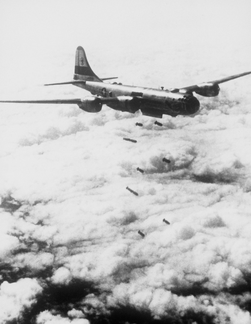 Lead bomber attacks enemy positions, as seen from B-29 Superfortress of Far East Air Forces 19th Bomber Group on its 150th combat mission since start of Korean War (Air and Space Museum)